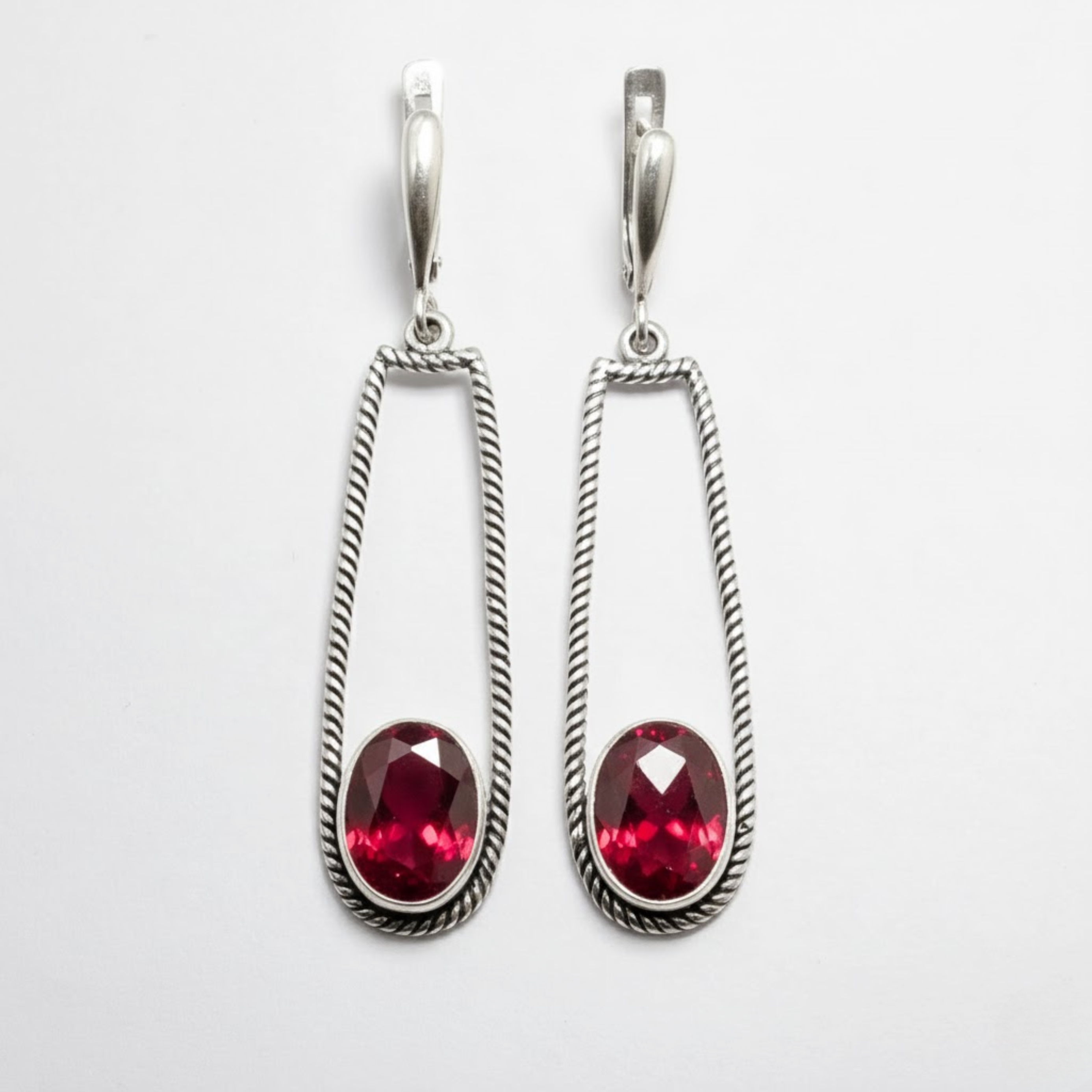 Created Ruby Earrings made in 925 Sterling Silver with Oval Created Red Ruby in Bezel setting, July Birthstone gift idea, symbolizes nobility, purity, and passion, ideal for everyday wear and perfect for birthday gifting and special occasions.