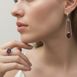 Stylish 925 sterling silver earrings featuring oval created red ruby, a symbol of passion, perfect for special occasions.