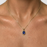 Elegant 18k Gold Vermeil Sapphire Pendant featuring a stunning oval created blue sapphire, perfect for special occasions.