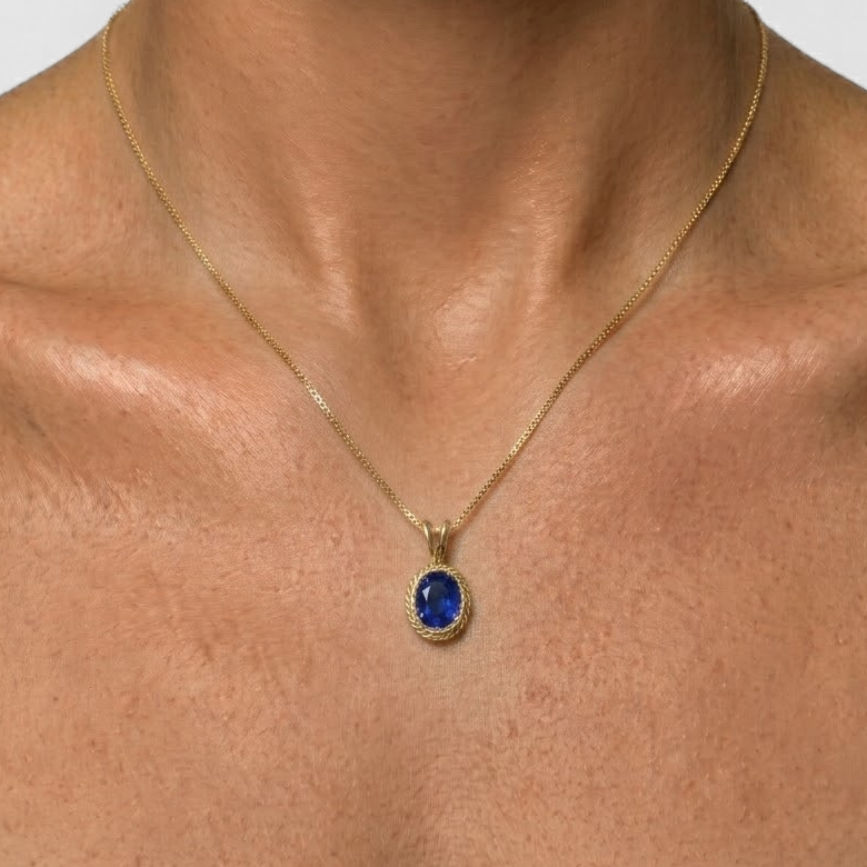 Elegant 18k Gold Vermeil Sapphire Pendant featuring a stunning oval created blue sapphire, perfect for special occasions.