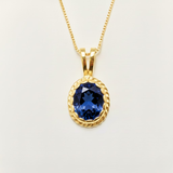 Elegant 18k Gold Vermeil Sapphire Pendant featuring a stunning oval created blue sapphire, perfect for special occasions.