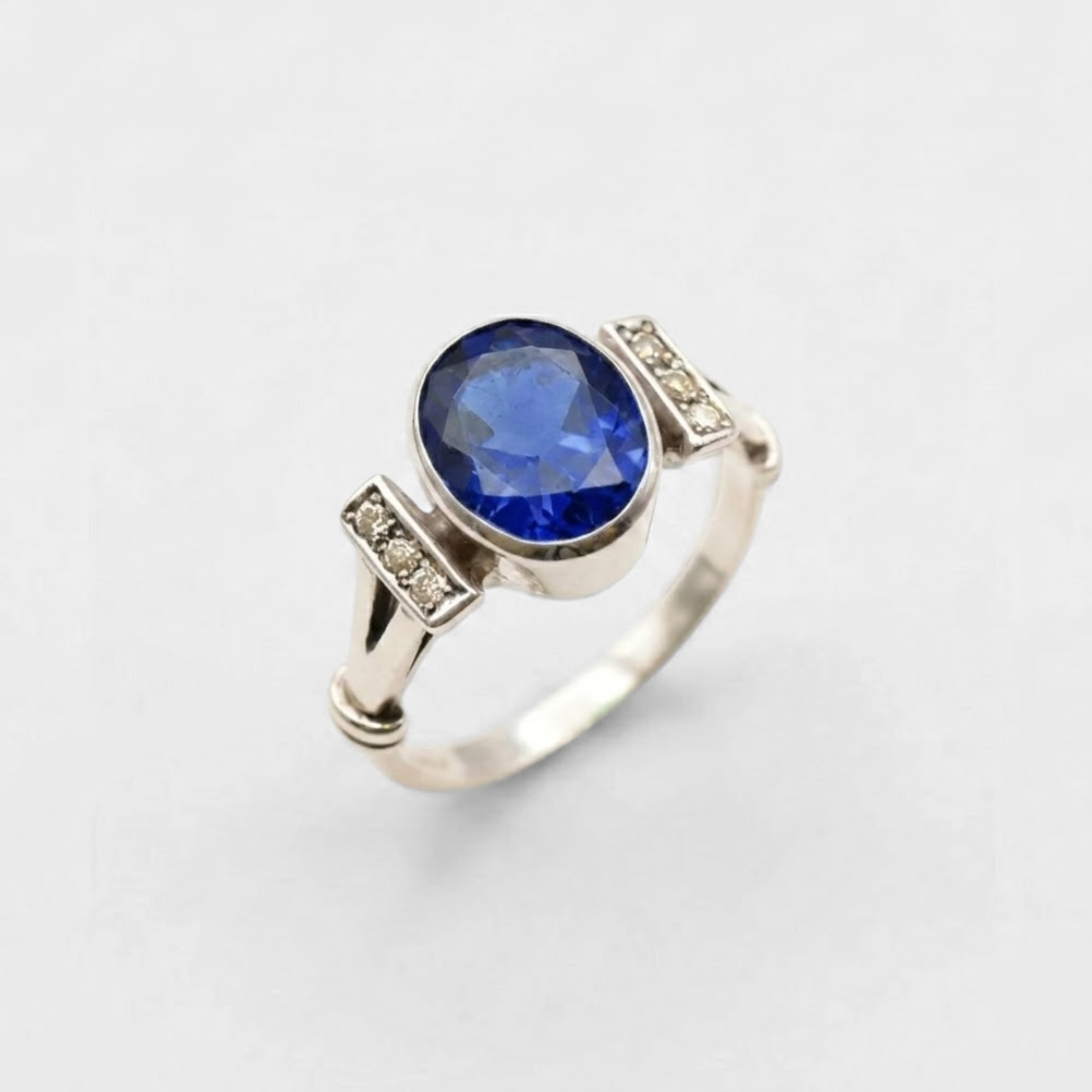 Created Sapphire Ring made in 925 Sterling Silver with Baguette Created Blue Sapphire in Bezel setting, September Birthstone gift idea, symbolizes sincerity, truth, and faithfulness, ideal for everyday wear and perfect for birthday gifting and special occasions.