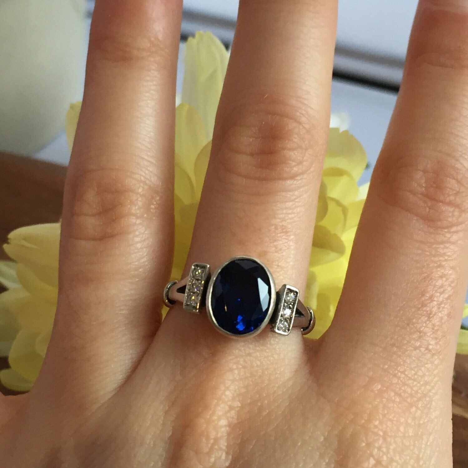 Created Sapphire Ring made in 925 Sterling Silver with Baguette Created Blue Sapphire in Bezel setting, September Birthstone gift idea, symbolizes sincerity, truth, and faithfulness, ideal for everyday wear and perfect for birthday gifting and special occasions.