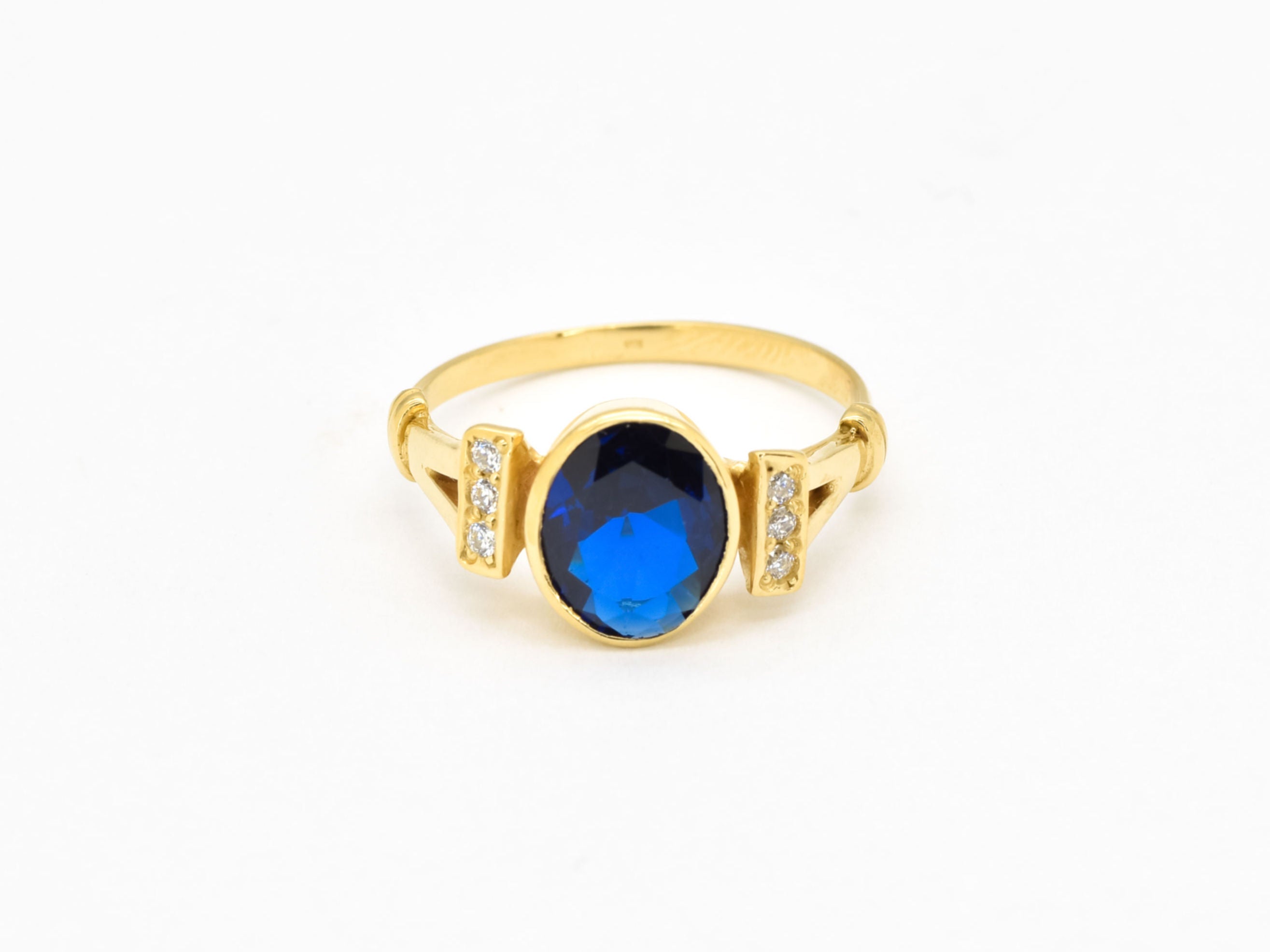 Created Sapphire Ring made in 18k Gold Vermeil with Oval Created Blue Sapphire in Bezel setting, September Birthstone gift idea, symbolizes sincerity, truth, and faithfulness, ideal for everyday wear and perfect for birthday gifting and special occasions.