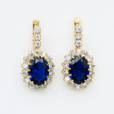 Created Sapphire Earrings made in 18k Gold Vermeil with Pear Created Blue Sapphire in Halo setting, September Birthstone gift idea, symbolizes sincerity, truth, and faithfulness, ideal for everyday wear and perfect for birthday gifting and special occasions.