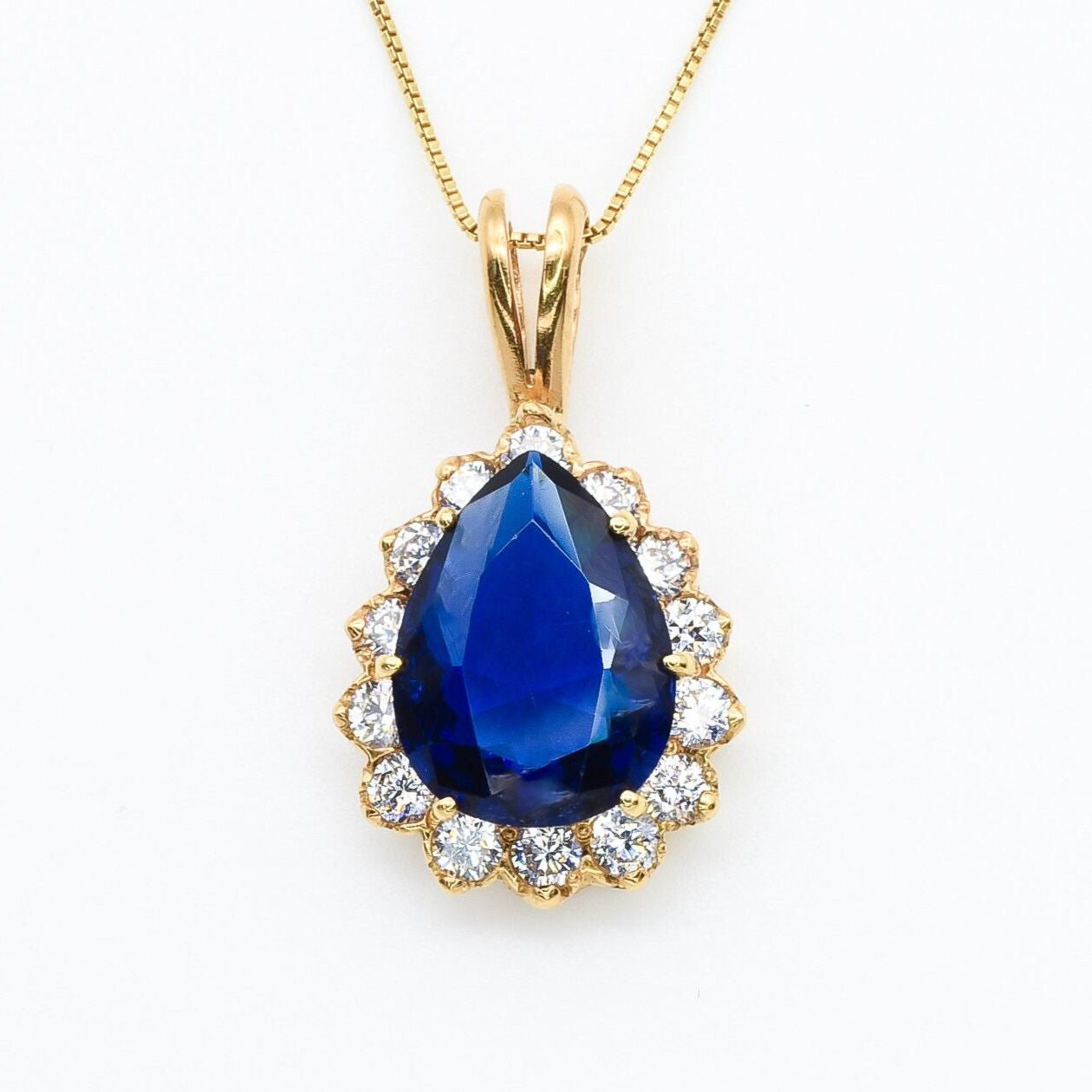Created Sapphire Pendant made in 18k Gold Vermeil with Pear Created Blue Sapphire in Prong setting, September Birthstone gift idea, symbolizes sincerity, truth, and faithfulness, ideal for everyday wear and perfect for birthday gifting and special occasions.