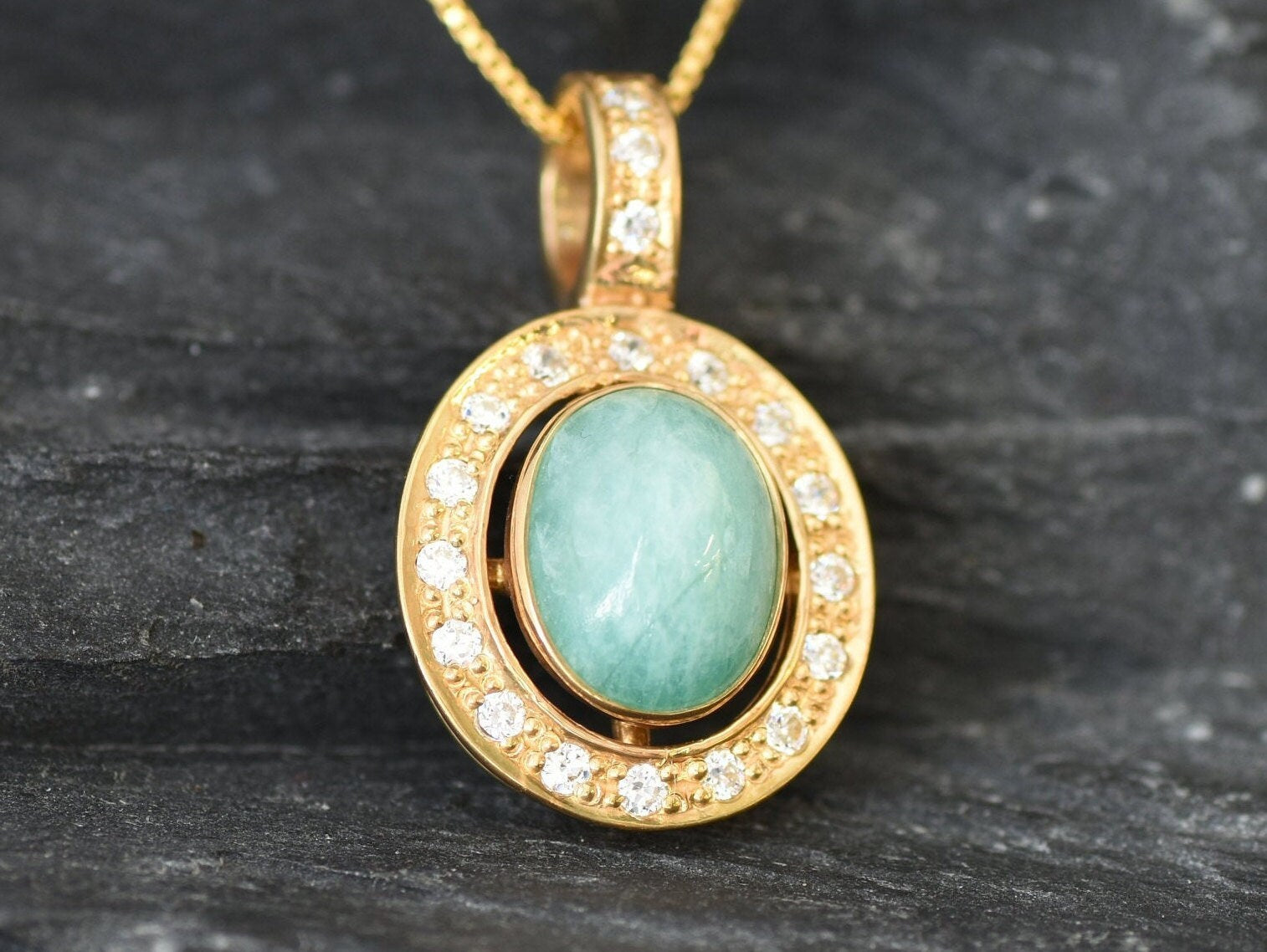 Elegant 18k Gold Vermeil pendant featuring an oval natural emerald, perfect for May birthdays and daily elegance.