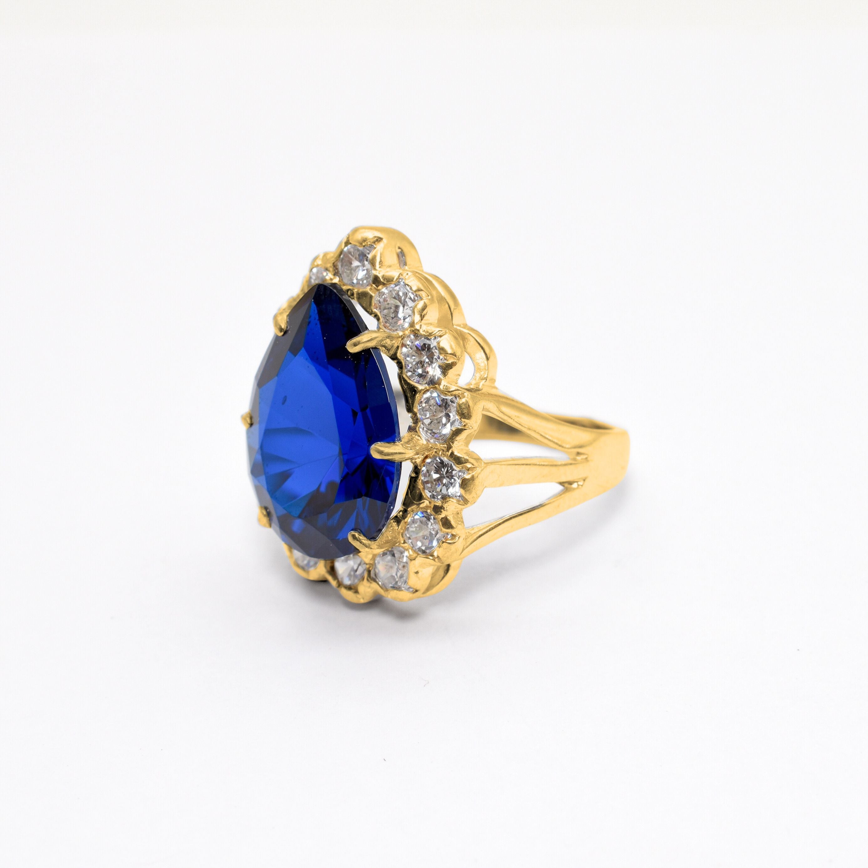 18k Gold Vermeil Sapphire Ring featuring a Pear Blue Sapphire, symbolizes tranquility and is great for daily wear or special occasions.