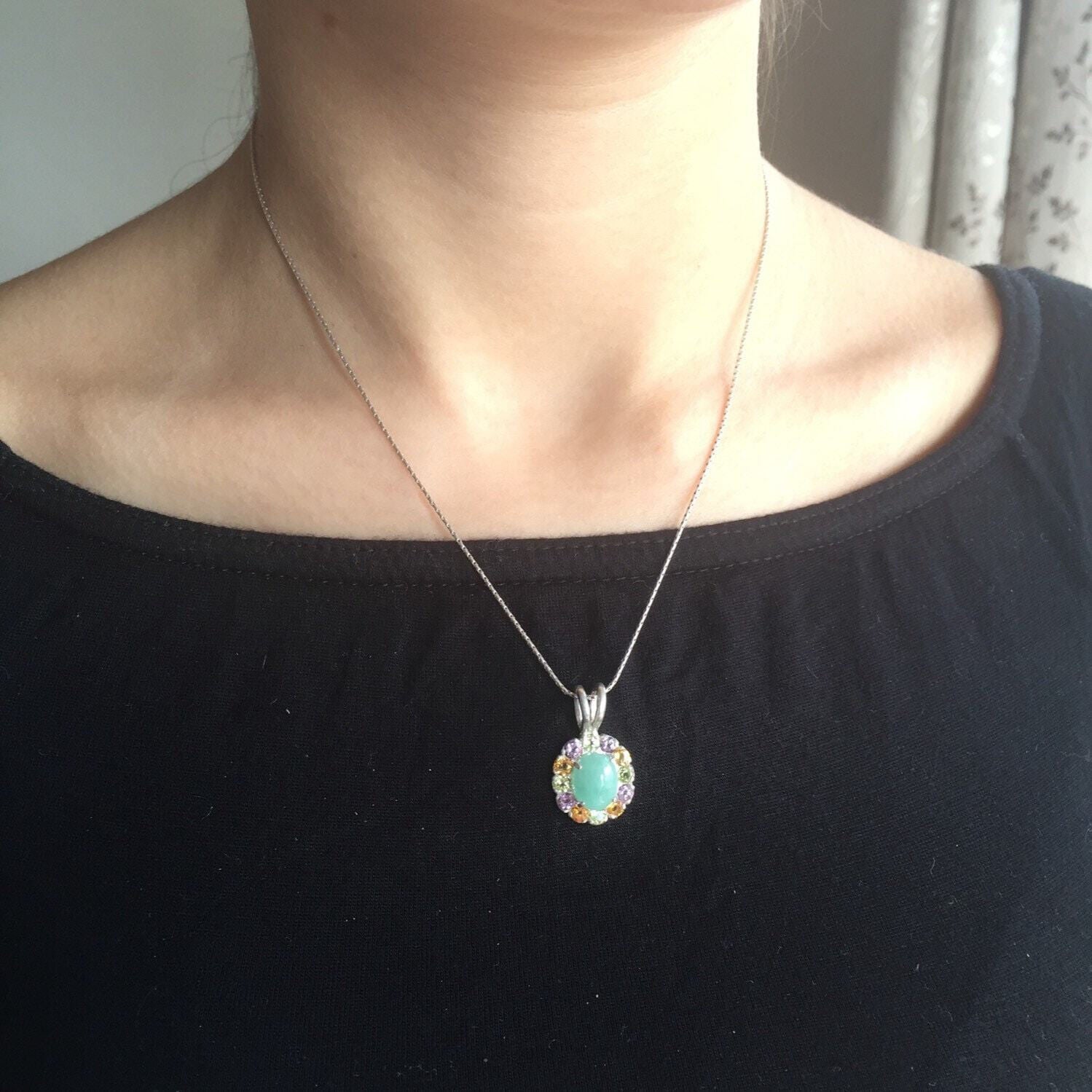 Elegant 925 Sterling Silver Halo Pendant featuring a Natural Oval Emerald, perfect for May birthdays and special occasions.