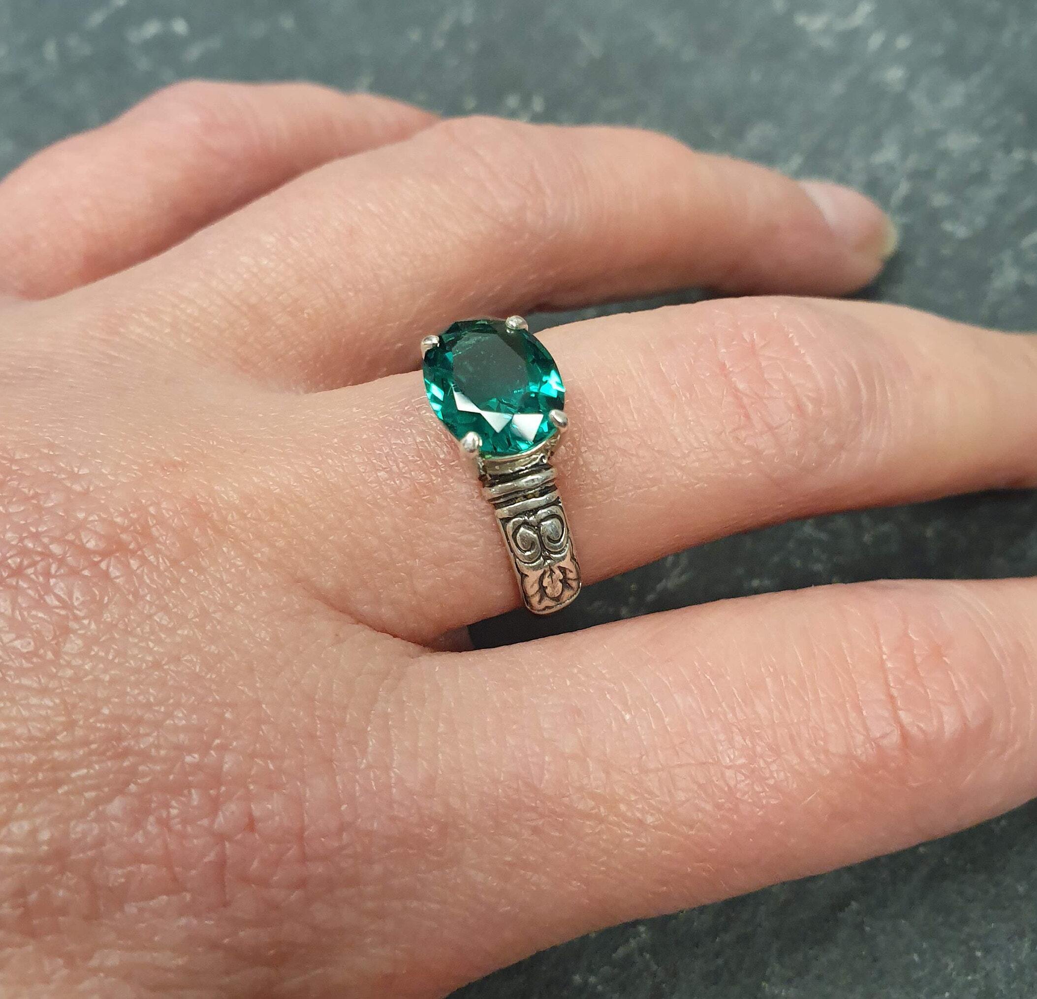 Elegant 925 Sterling Silver Ring featuring a stunning Oval Created Green Emerald, perfect for May birthdays and special occasions.