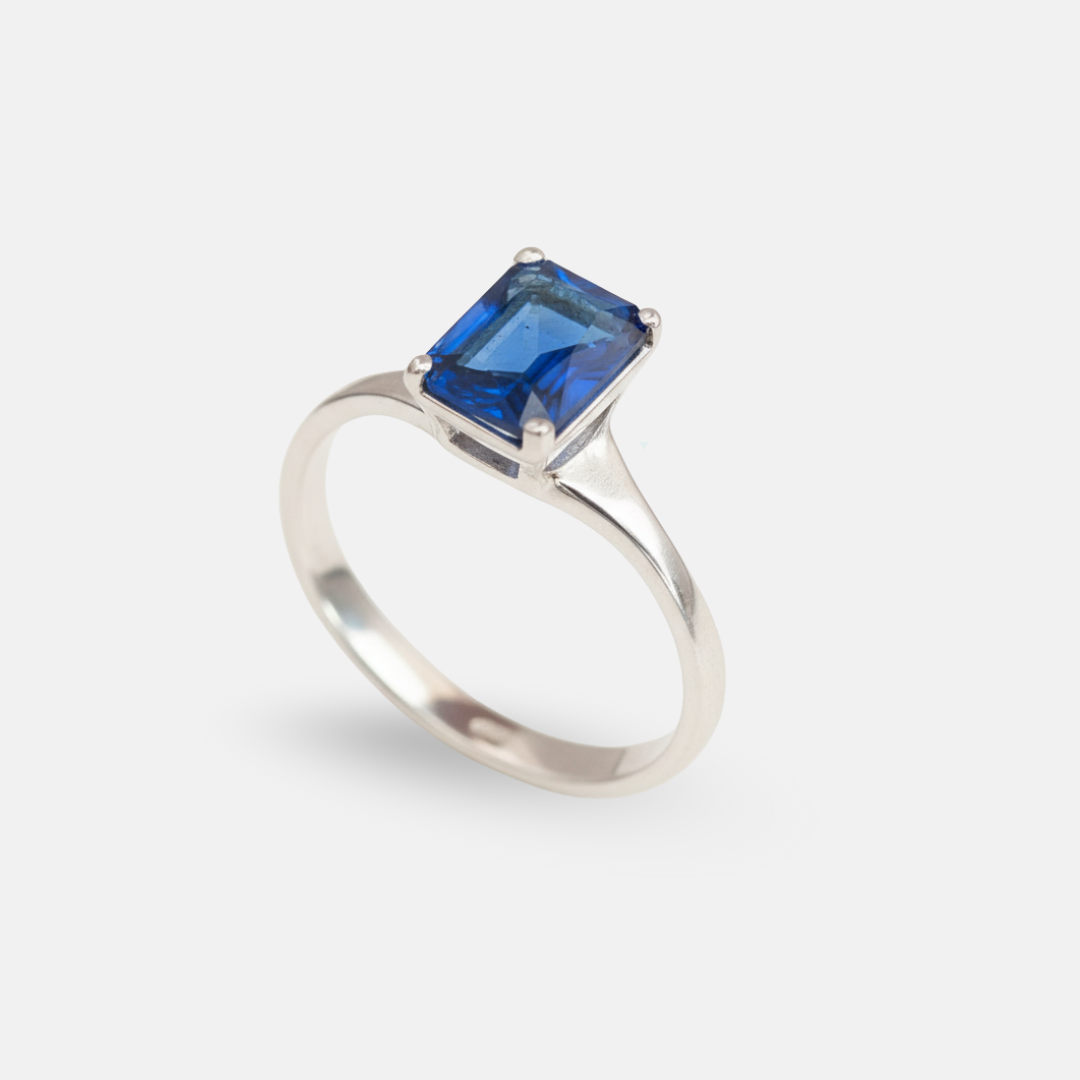 Charming Created Sapphire Ring in 925 Sterling Silver, showcasing a Baguette Blue Sapphire, symbolizes faithfulness and love.