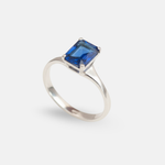 Charming Created Sapphire Ring in 925 Sterling Silver, showcasing a Baguette Blue Sapphire, symbolizes faithfulness and love.