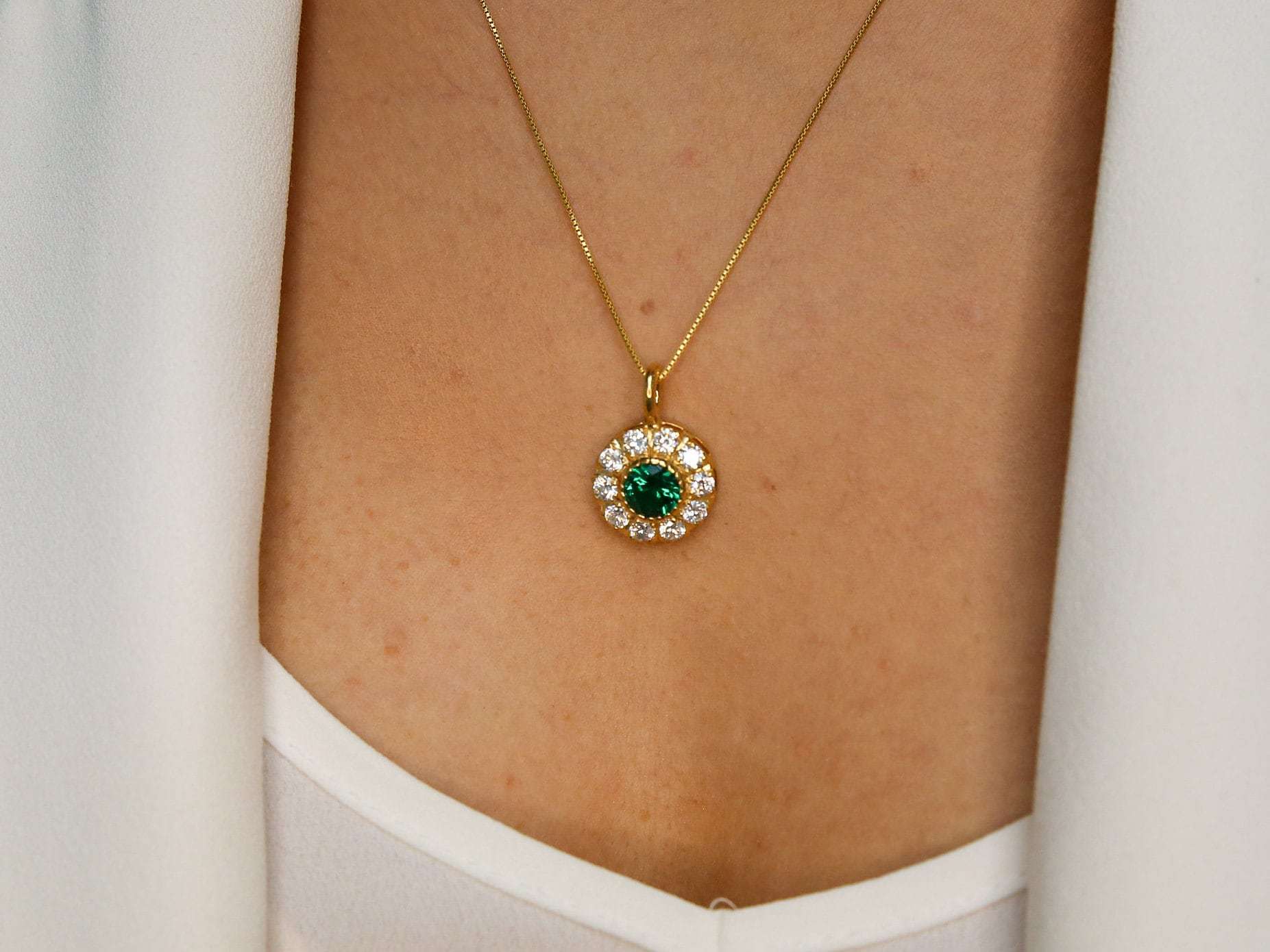 Emerald pendant in 18k gold vermeil, featuring a round green emerald halo. Perfect for May birthdays and special occasions.