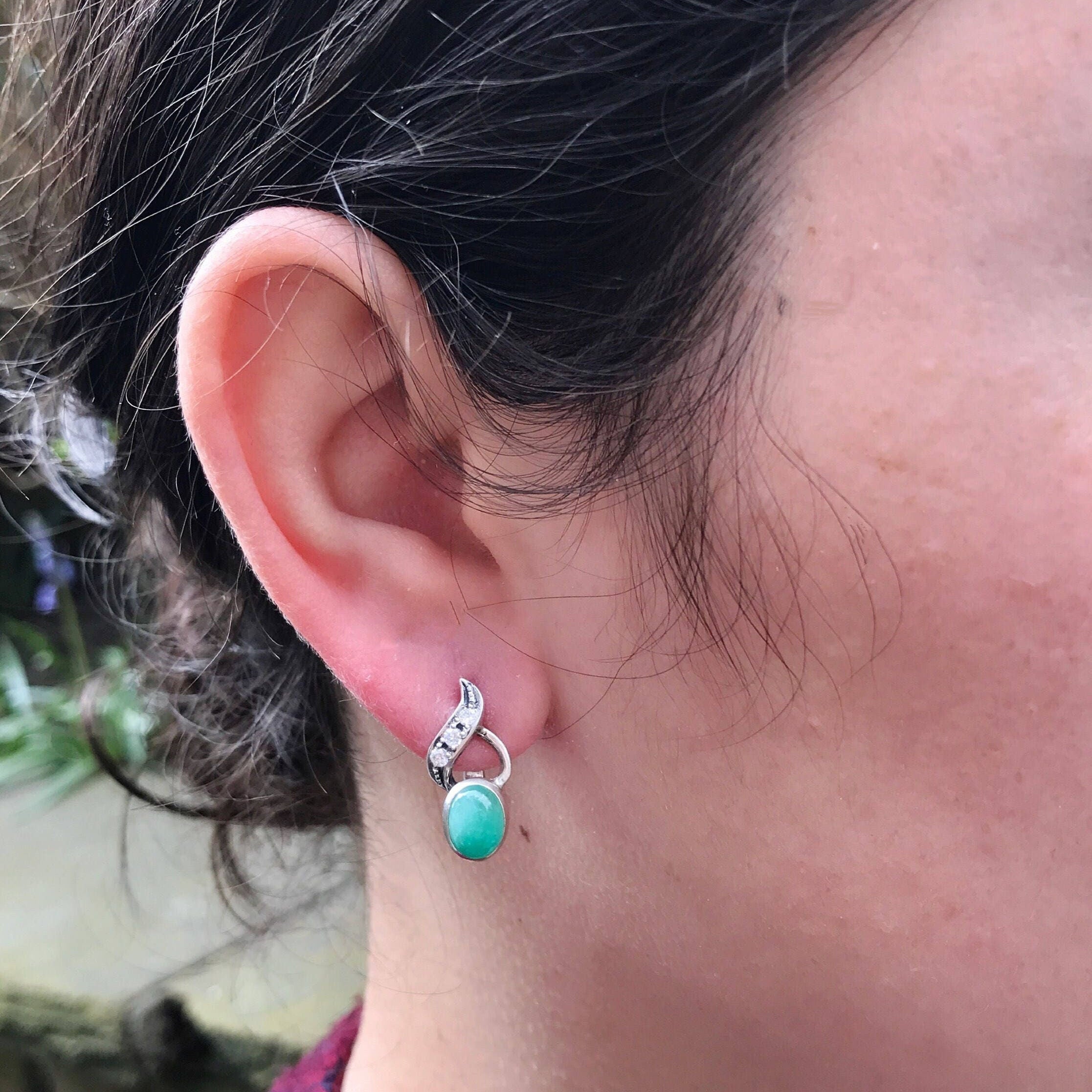 Sterling Silver Natural Emerald Earrings in Bezel setting, a May birthstone symbolizing growth and harmony, perfect for any occasion.