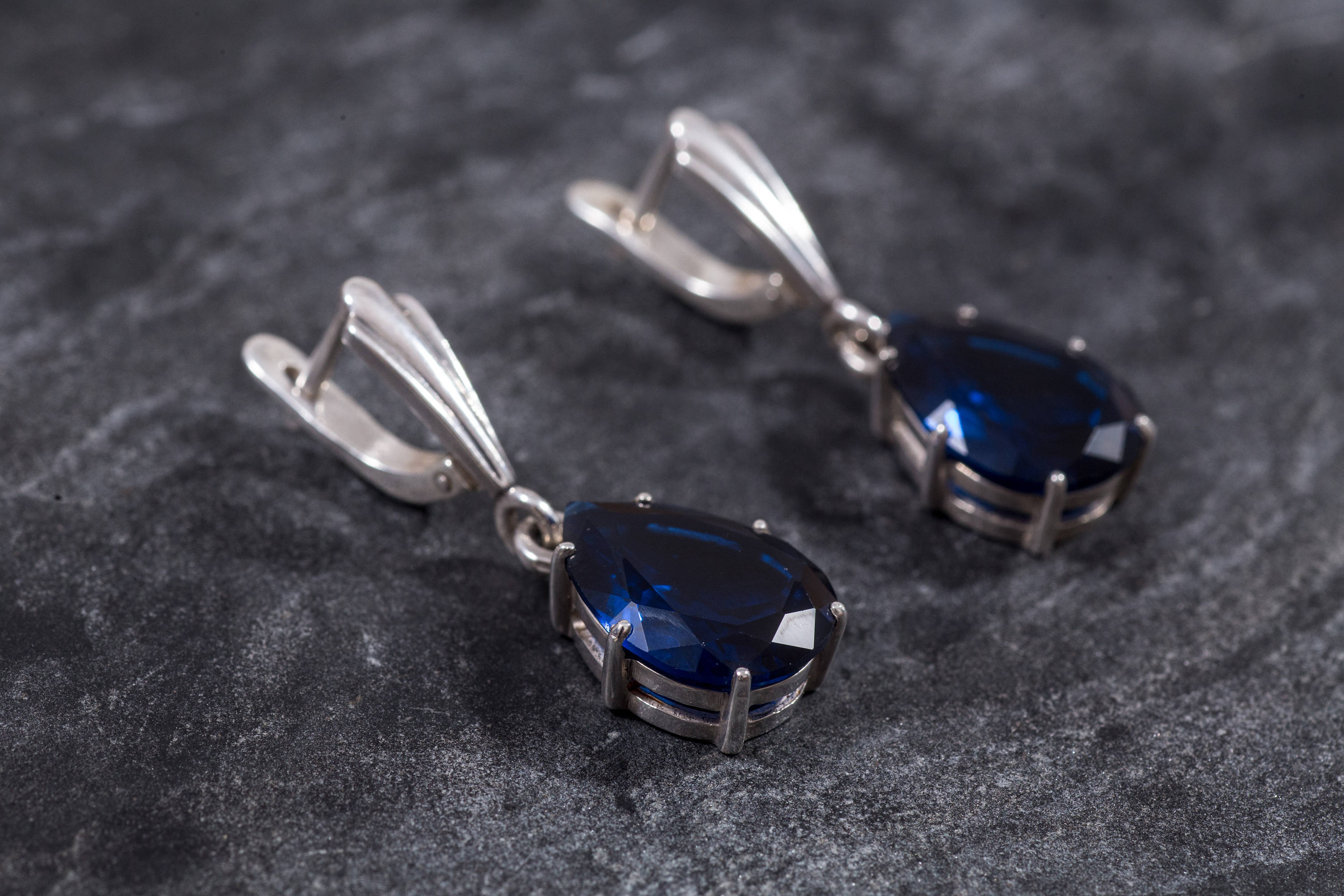 Created Sapphire Earrings made in 925 Sterling Silver with Pear Created Blue Sapphire in Prong setting, September Birthstone gift idea, symbolizes sincerity, truth, and faithfulness, ideal for everyday wear and perfect for birthday gifting and special occasions.