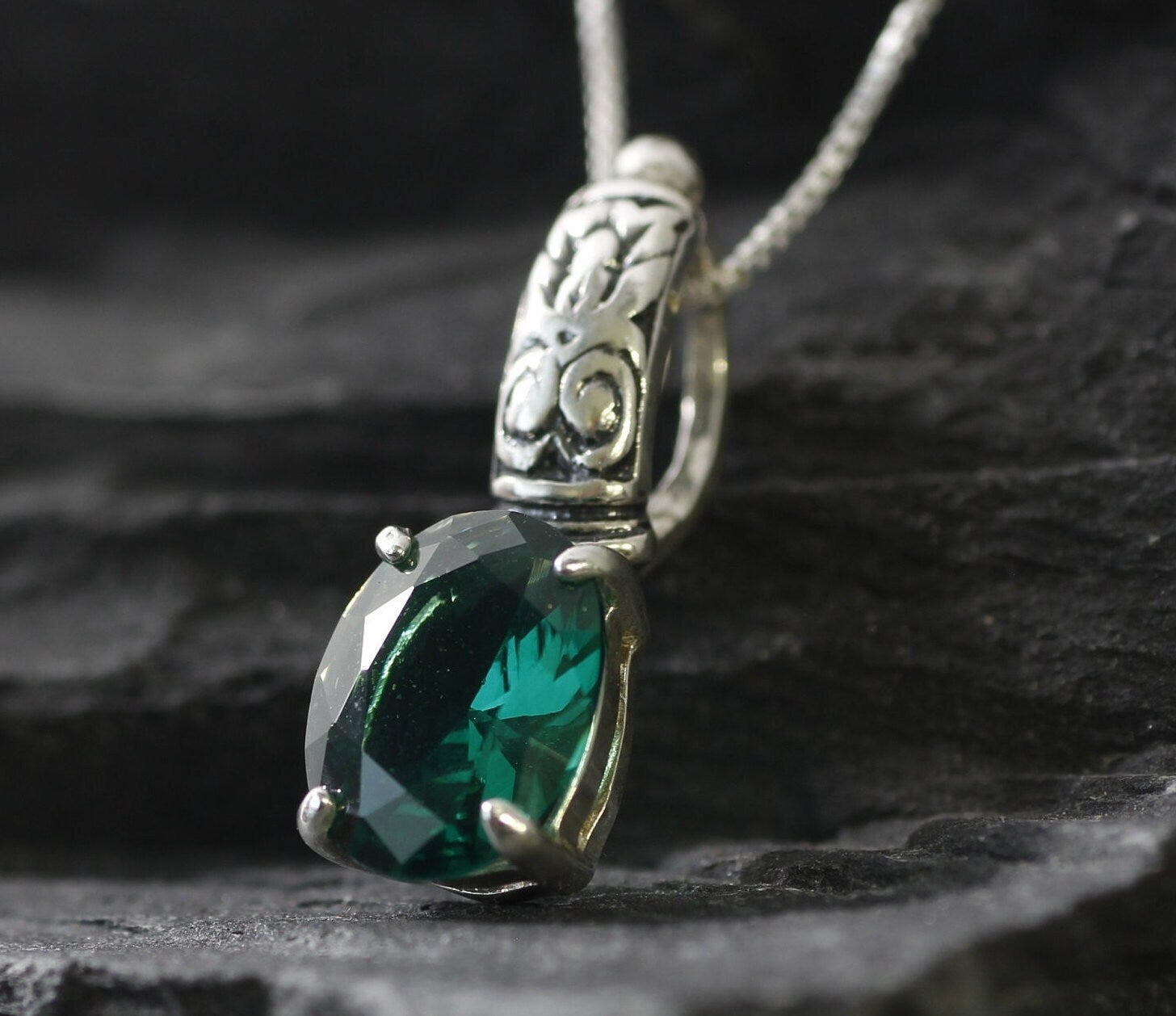 Elegant 925 Sterling Silver pendant featuring a stunning Oval Created Green Emerald, perfect for May birthdays and special occasions.