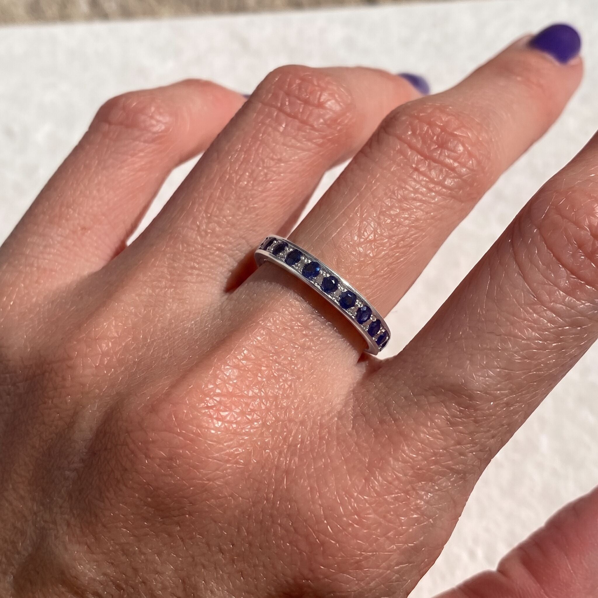 Channel-set created sapphire ring in 925 sterling silver, symbolizing September birthdays and representing sincerity and faithfulness.
