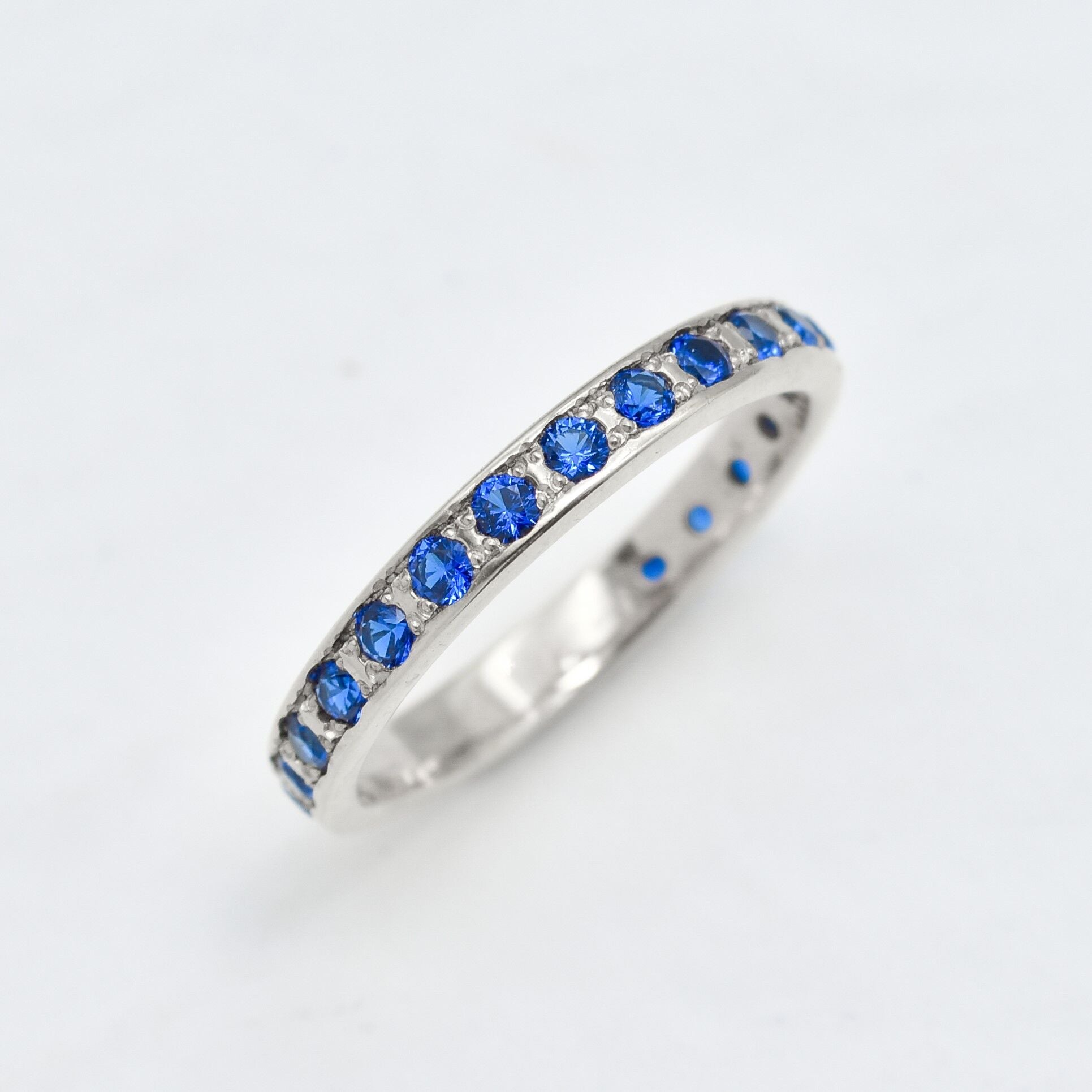 Created Sapphire Ring made in 925 Sterling Silver with Round Created Blue Sapphire in Channel-Set setting, September Birthstone gift idea, symbolizes sincerity, truth, and faithfulness, ideal for everyday wear and perfect for birthday gifting and special occasions.