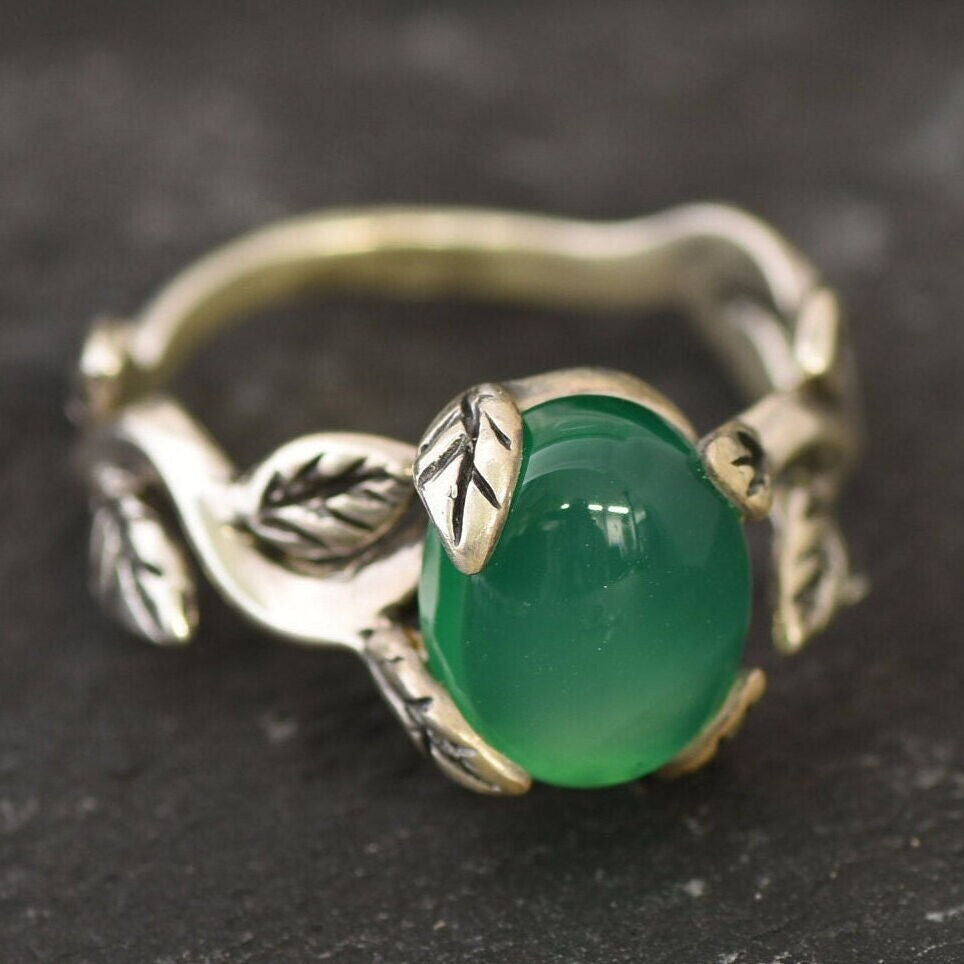 Stylish 925 Sterling Silver ring showcasing an oval Created Green Emerald, a meaningful gift for May birthdays and special moments.