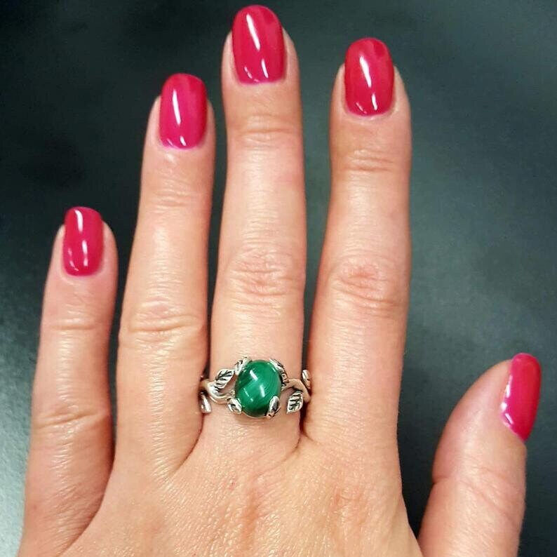 Sleek 925 Sterling Silver ring set with an oval Created Green Emerald, ideal for May birthdays and memorable celebrations.