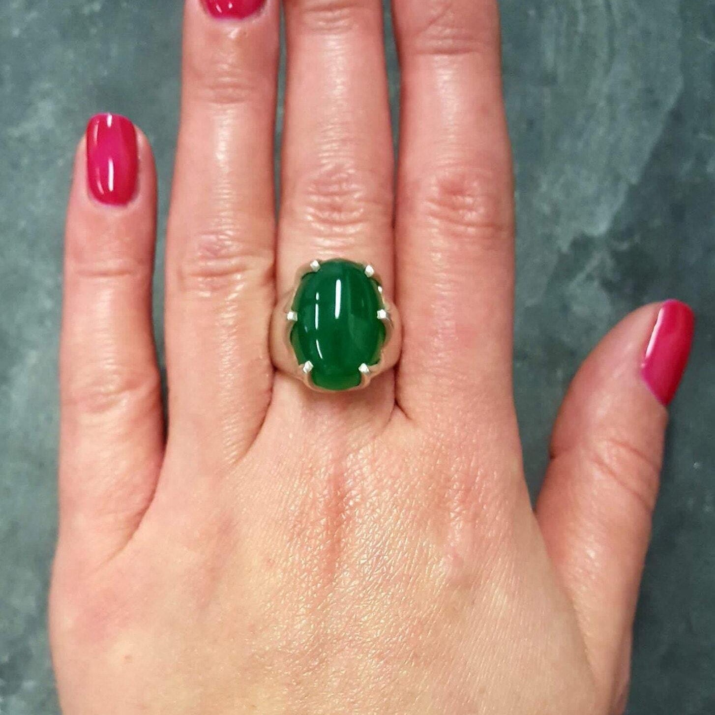 Elegant 925 Sterling Silver ring with an oval Created Green Emerald, perfect for May birthdays and special occasions.