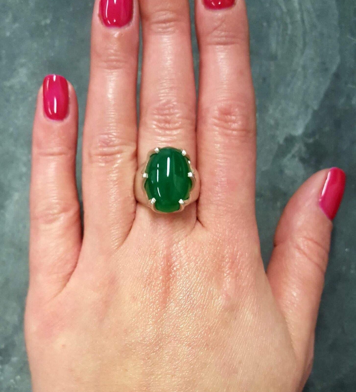 Elegant 925 Sterling Silver ring with an oval Created Green Emerald, perfect for May birthdays and special occasions.