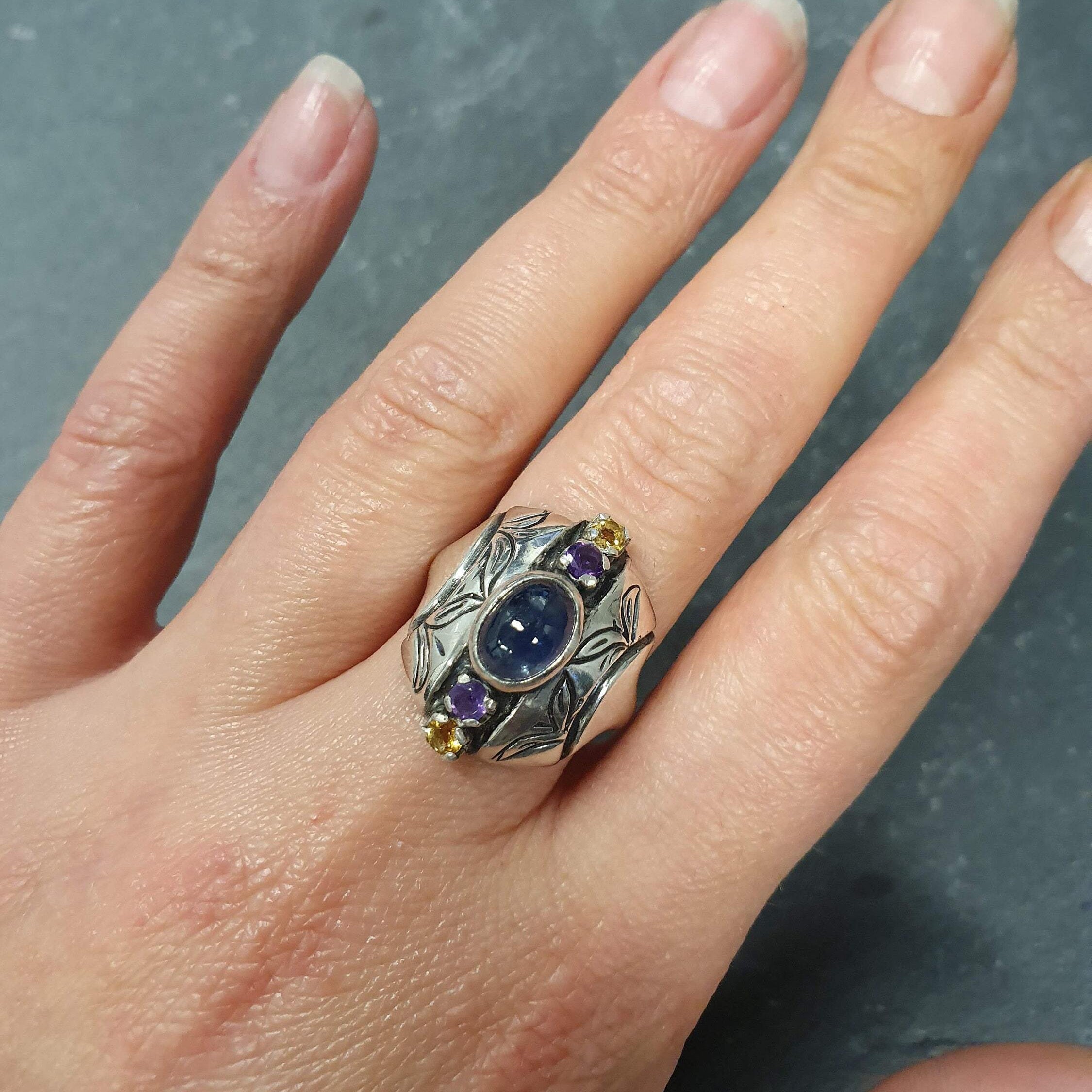 Elegant 925 Sterling Silver ring featuring an oval natural blue sapphire, perfect for birthdays and special occasions.