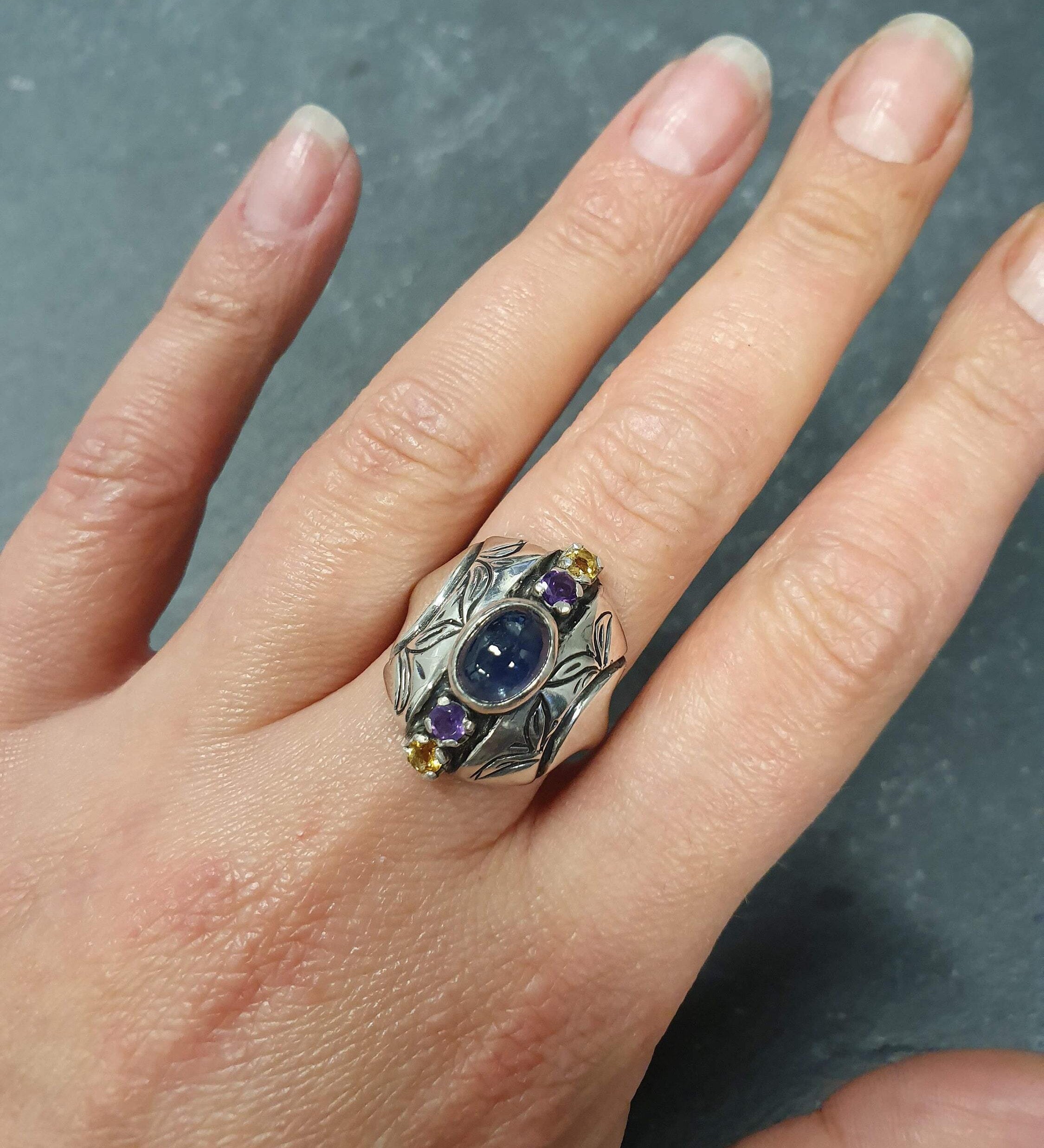 Elegant 925 Sterling Silver ring featuring an oval natural blue sapphire, perfect for birthdays and special occasions.