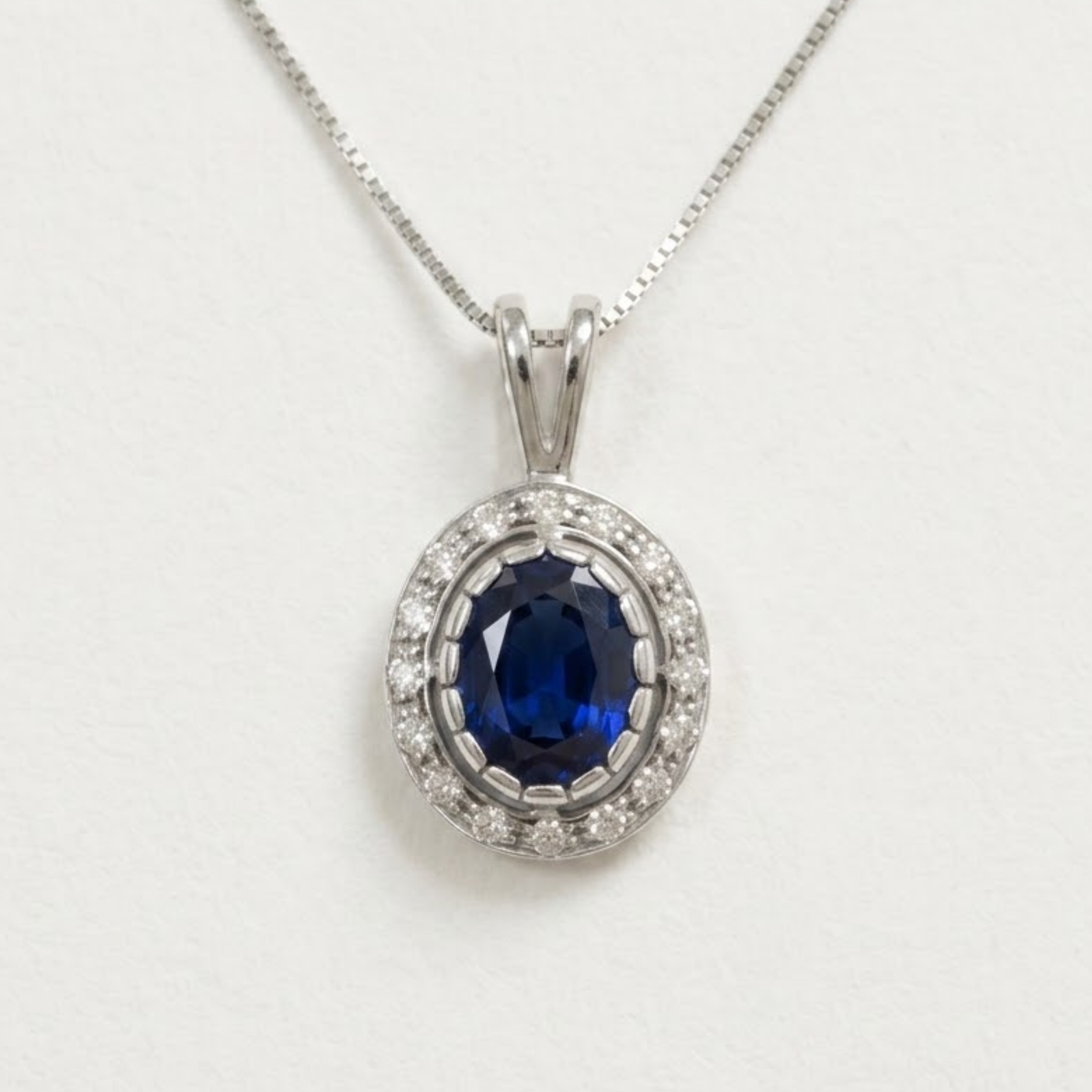 Created Sapphire Pendant made in 925 Sterling Silver with Oval Created Blue Sapphire in Halo setting, September Birthstone gift idea, symbolizes sincerity, truth, and faithfulness, ideal for everyday wear and perfect for birthday gifting and special occasions.