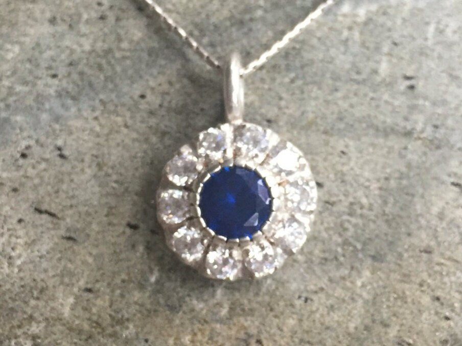 Created Sapphire Pendant made in 925 Sterling Silver with Round Created Blue Sapphire in Halo setting, September Birthstone gift idea, symbolizes sincerity, truth, and faithfulness, ideal for everyday wear and perfect for birthday gifting and special occasions.