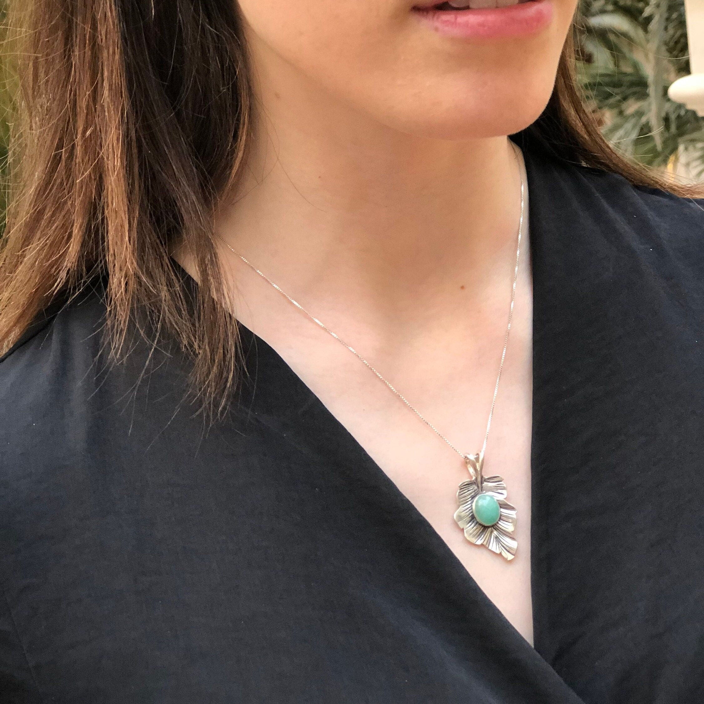 Elegant 925 Sterling Silver pendant featuring an oval Natural Emerald, perfect for May birthdays and special occasions.