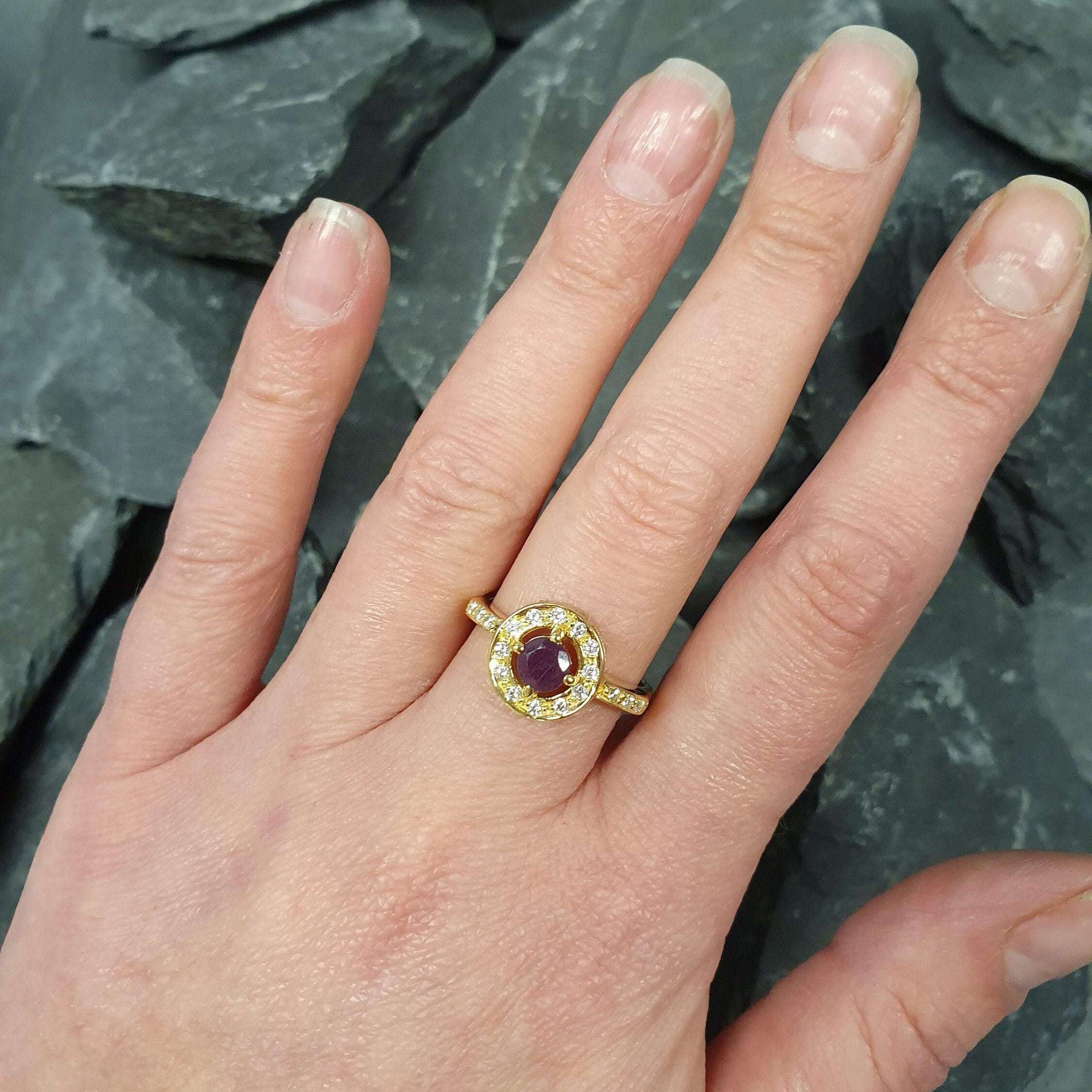 Elegant 18k Gold Vermeil ring featuring a round natural red ruby in a stunning halo setting, perfect for birthdays and special occasions.