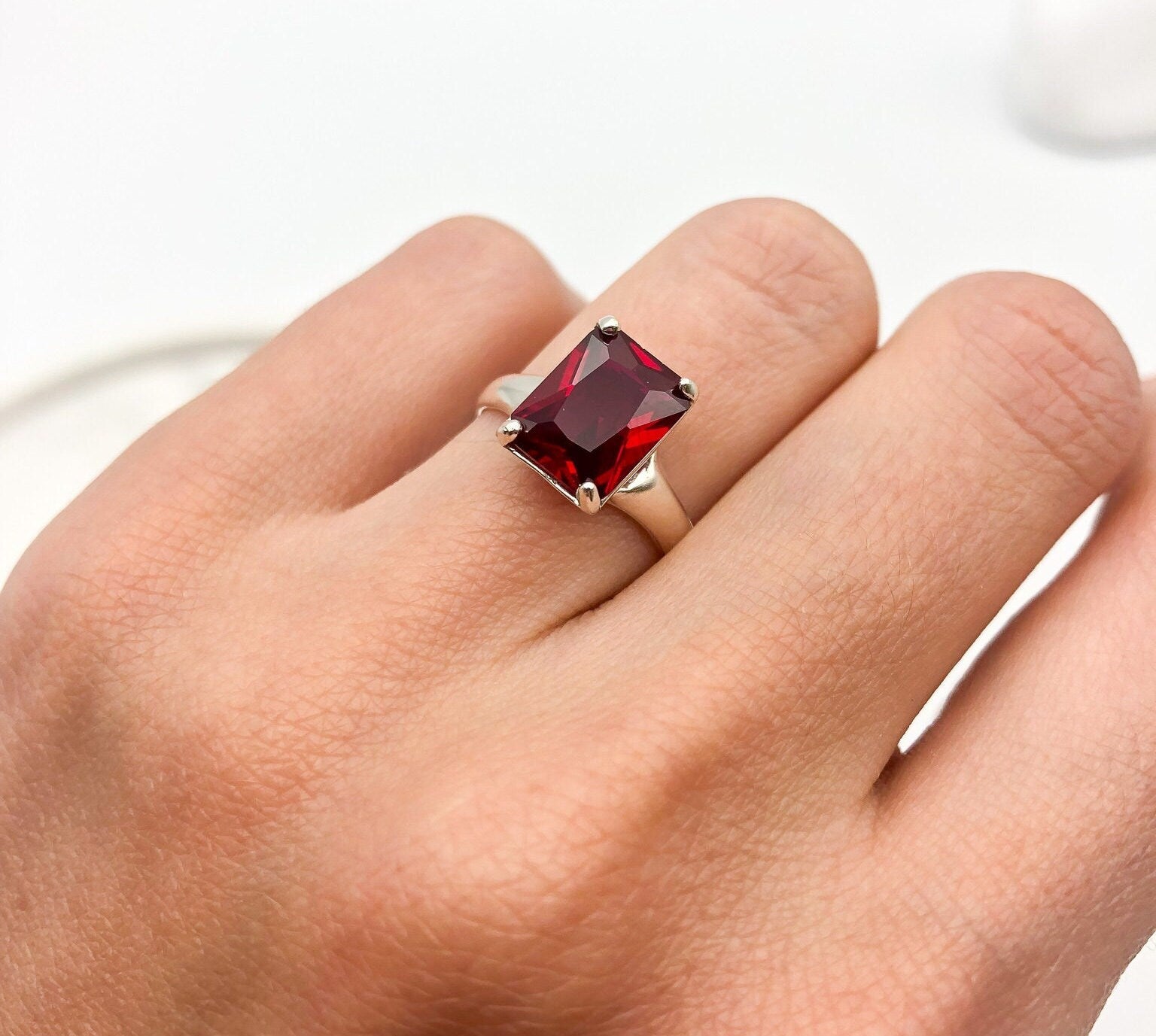 Elegant 925 Sterling Silver ring featuring a stunning Baguette Created Red Ruby, perfect for July birthdays and special occasions.