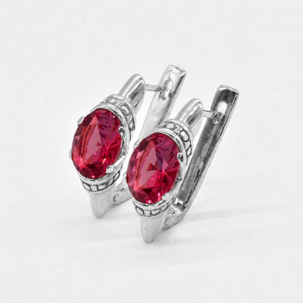 Created Ruby Earrings made in 925 Sterling Silver with Oval Created Red Ruby in Solitaire setting, July Birthstone gift idea, symbolizes nobility, purity, and passion, ideal for everyday wear and perfect for birthday gifting and special occasions.