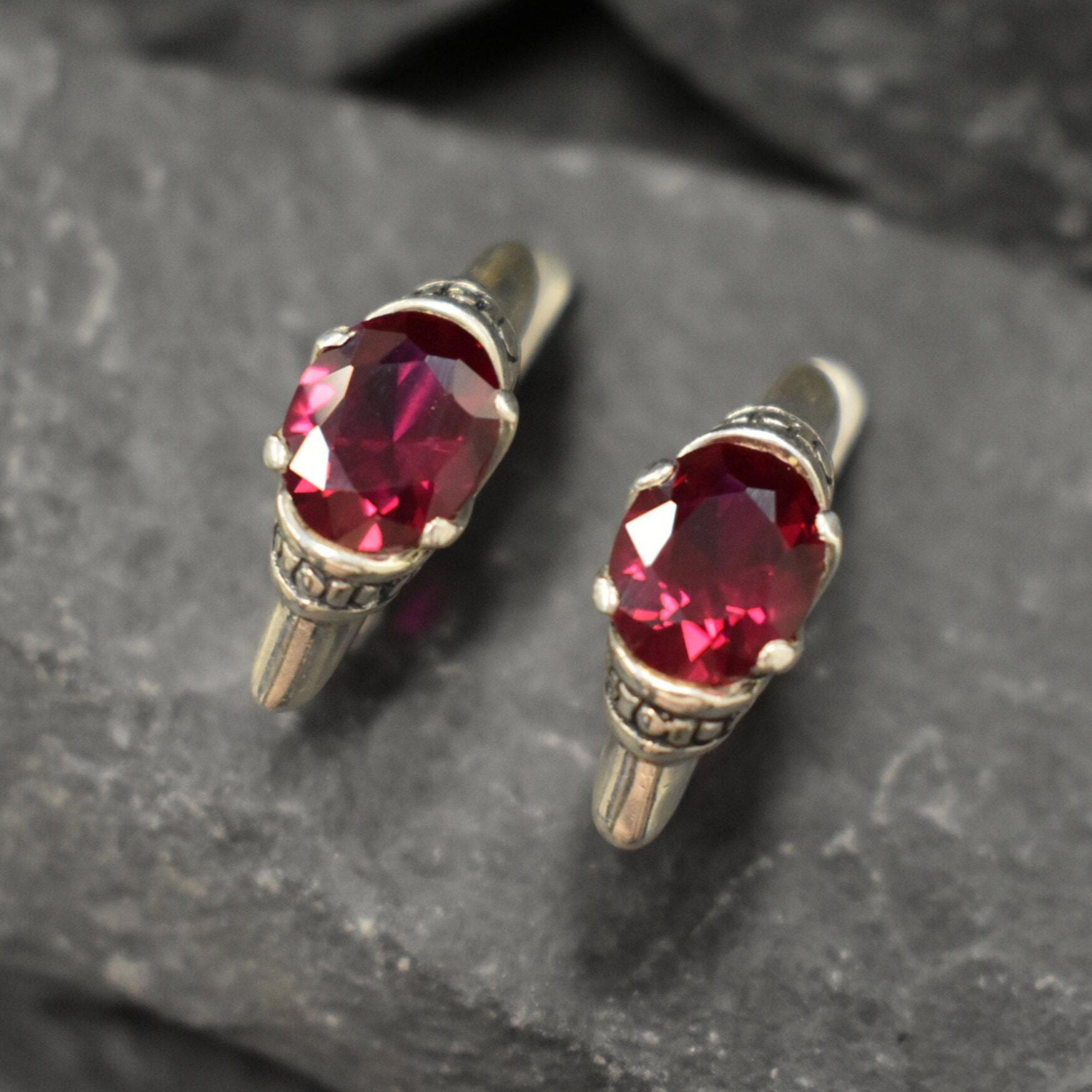 Created Ruby Earrings made in 925 Sterling Silver with Oval Created Red Ruby in Solitaire setting, July Birthstone gift idea, symbolizes nobility, purity, and passion, ideal for everyday wear and perfect for birthday gifting and special occasions.