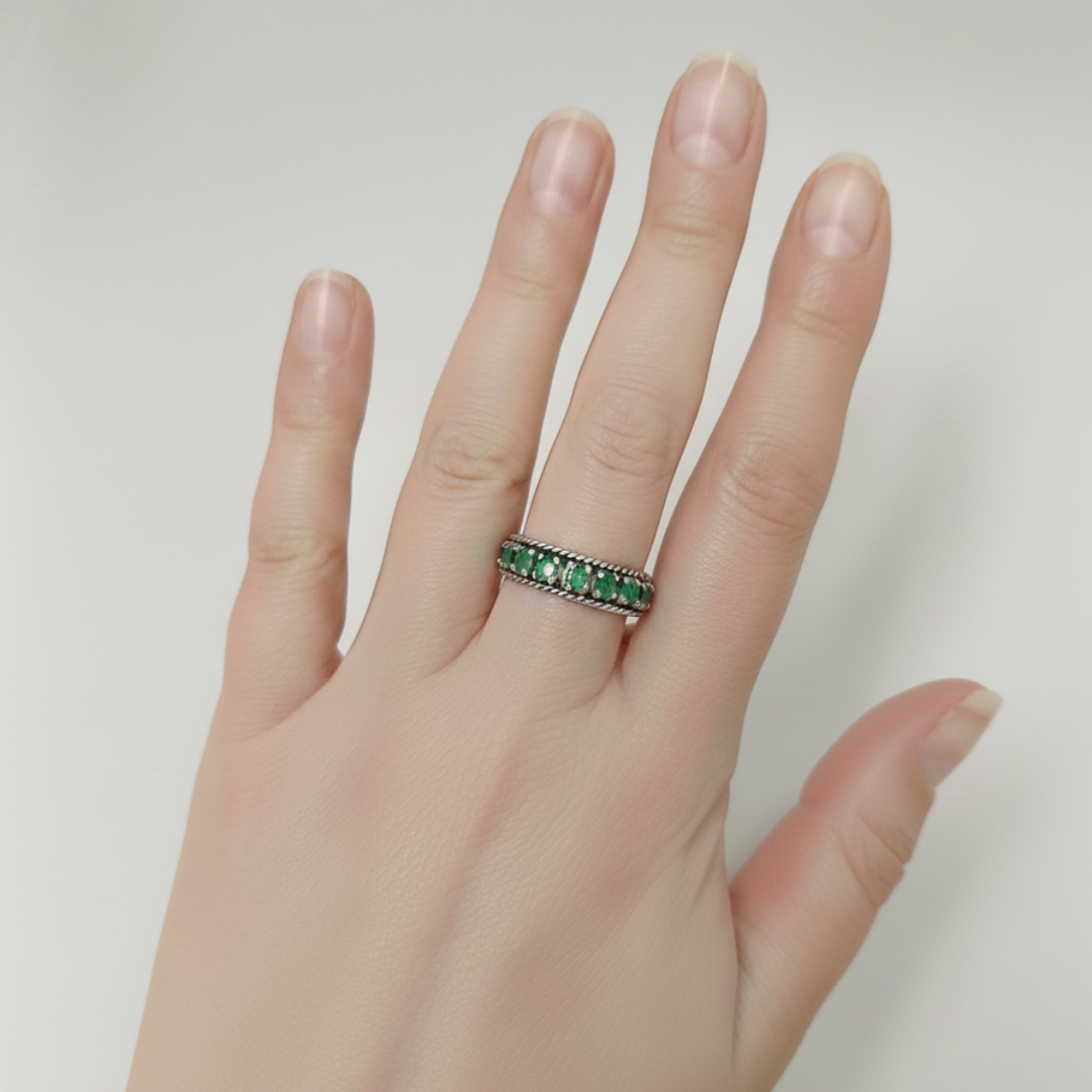 Channel-set natural emerald ring in 925 sterling silver, perfect May birthstone gift for growth and harmony.