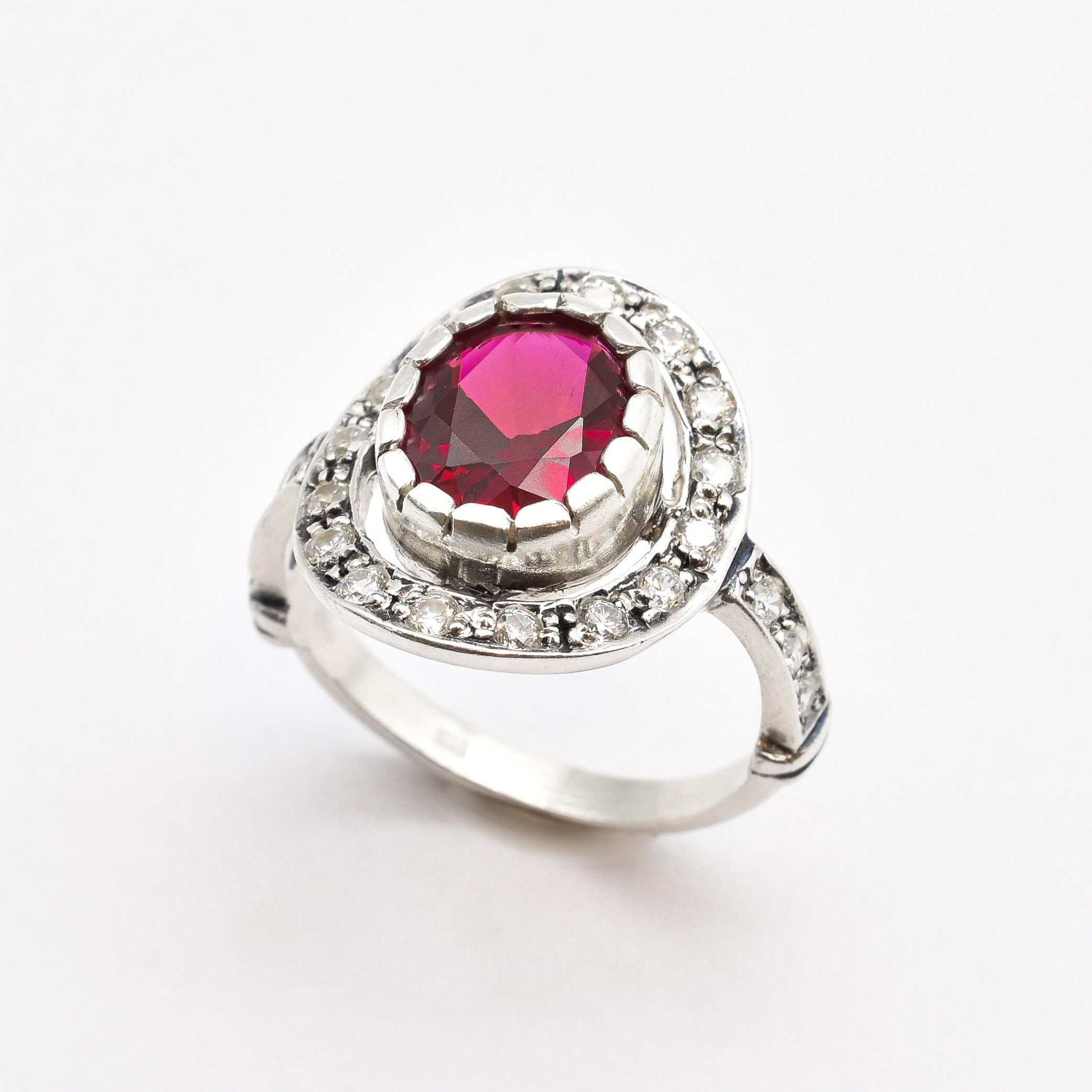 Created Ruby Ring made in 925 Sterling Silver with Oval Created Red Ruby in Halo setting, July Birthstone gift idea, symbolizes nobility, purity, and passion, ideal for everyday wear and perfect for birthday gifting and special occasions.