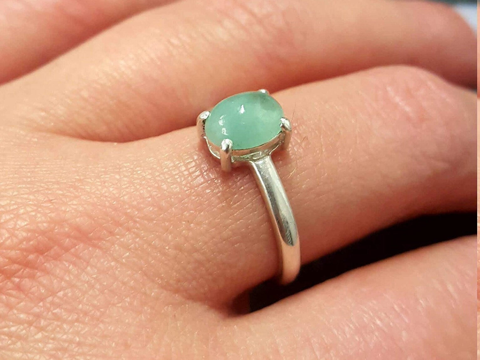 Elegant 925 Sterling Silver ring featuring a prong-set Oval Natural Emerald, perfect for May birthdays and special occasions.