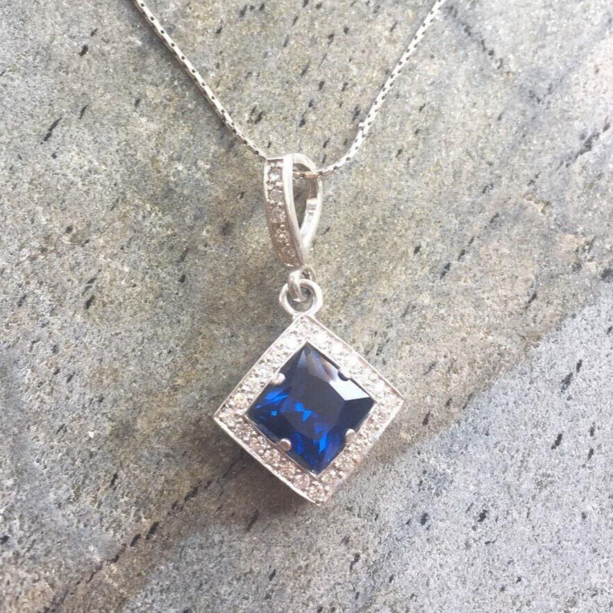 Created Sapphire Pendant made in 925 Sterling Silver with Square Created Blue Sapphire in Halo setting, September Birthstone gift idea, symbolizes sincerity, truth, and faithfulness, ideal for everyday wear and perfect for birthday gifting and special occasions.