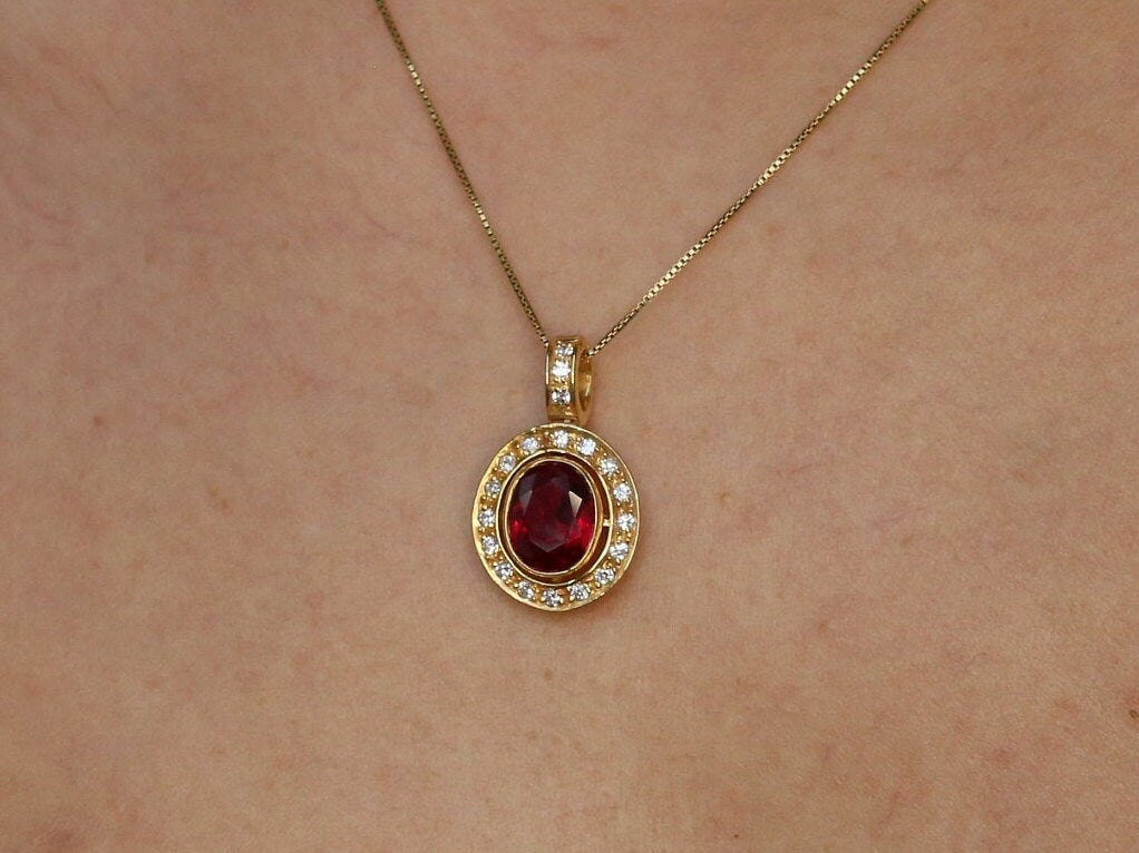 18k Gold Vermeil Ruby Pendant featuring a bezel-set oval created red ruby, perfect for July birthdays and special occasions.