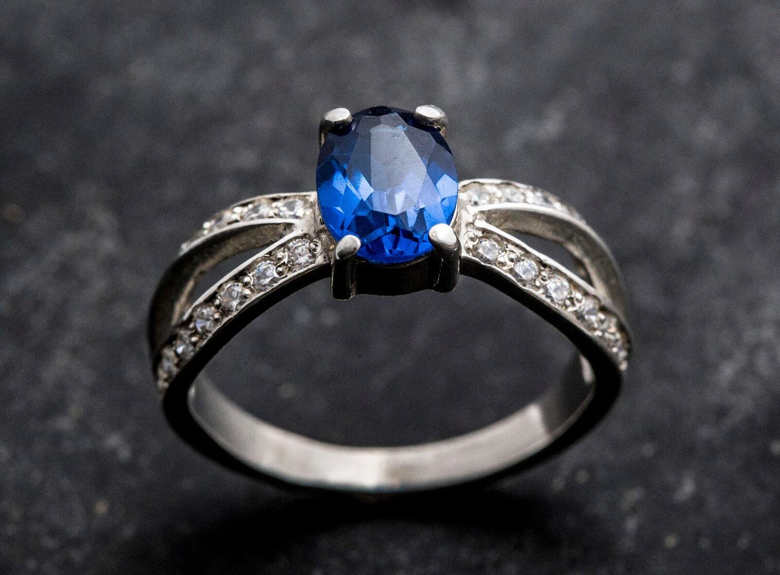 Created Sapphire Ring made in 925 Sterling Silver with Baguette Created Blue Sapphire in Solitaire with Accents setting, September Birthstone gift idea, symbolizes sincerity, truth, and faithfulness, ideal for everyday wear and perfect for birthday gifting and special occasions.