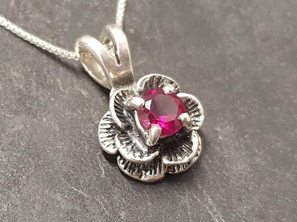 Striking 925 Sterling Silver Ruby Pendant featuring a round created ruby, a cherished piece for everyday elegance and July birthdays.