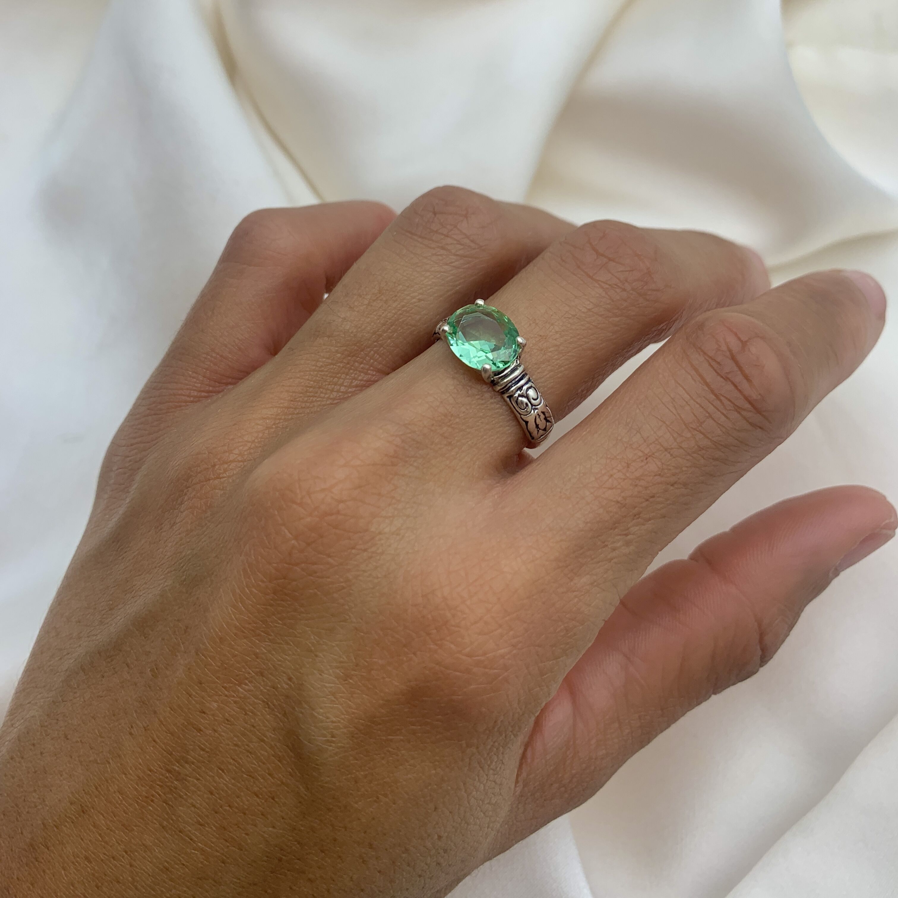 Elegant 925 Sterling Silver ring featuring a stunning Oval Created Green Emerald, perfect for May birthdays and special occasions.