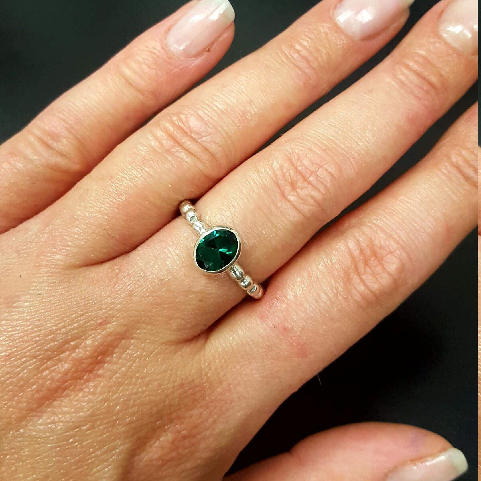Radiant 925 Sterling Silver ring featuring an exquisite oval Created Green Emerald, a meaningful May birthstone gift for any occasion.
