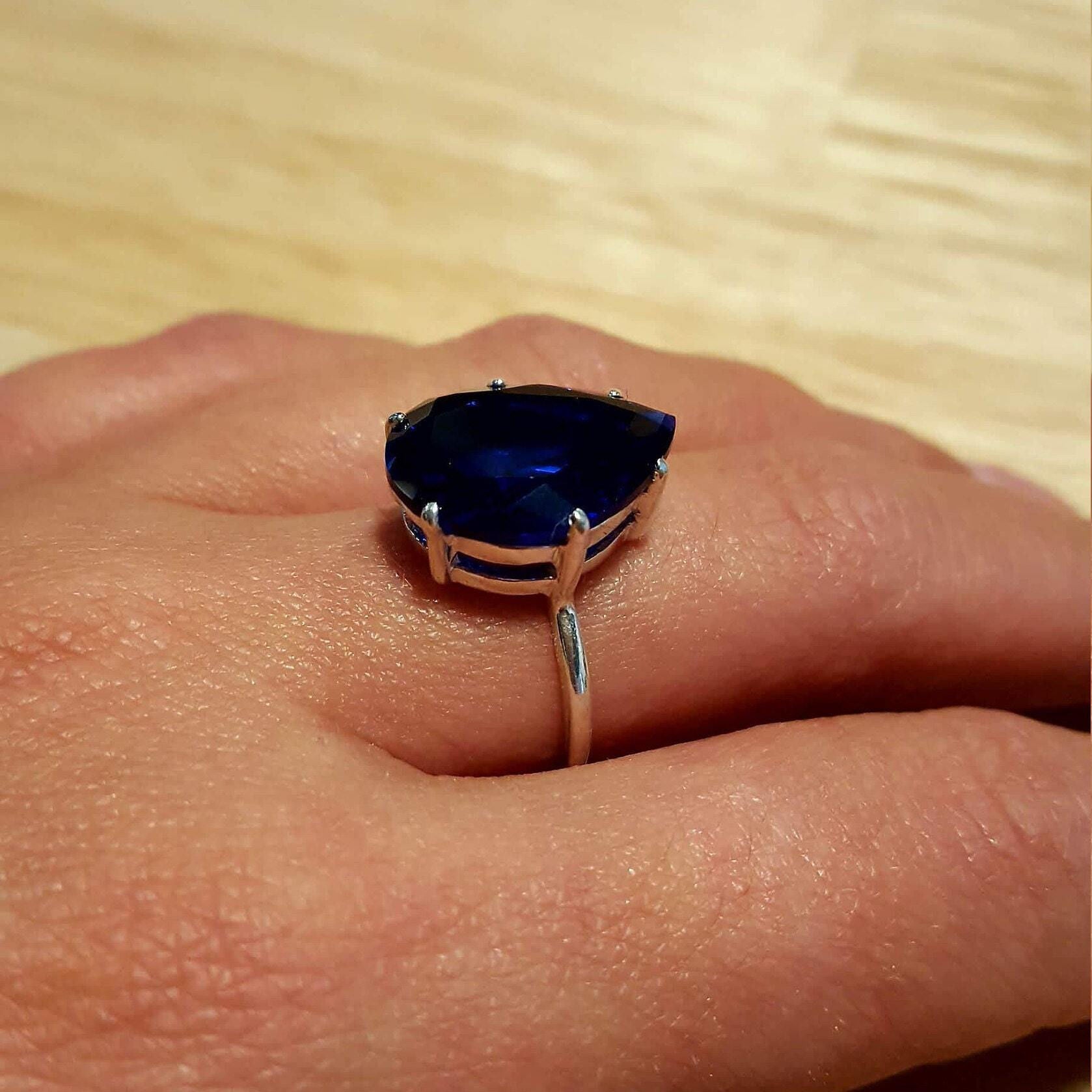 Sterling Silver Sapphire Ring with Pear Shaped Blue Sapphire, perfect for birthdays and symbolizes sincerity and faithfulness.
