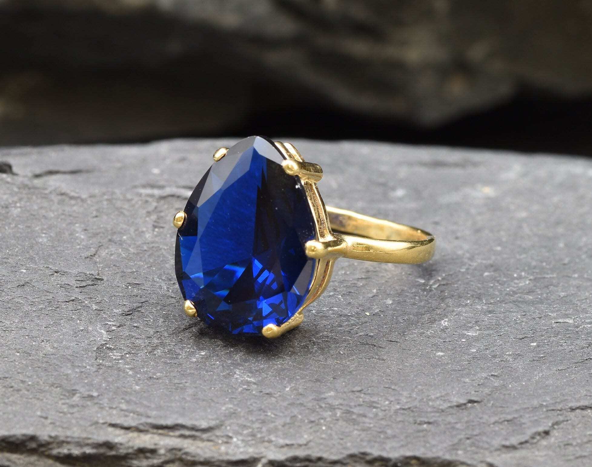 Created Sapphire Ring made in 18k Gold Vermeil with Pear Created Blue Sapphire in Prong setting, September Birthstone gift idea, symbolizes sincerity, truth, and faithfulness, ideal for everyday wear and perfect for birthday gifting and special occasions.