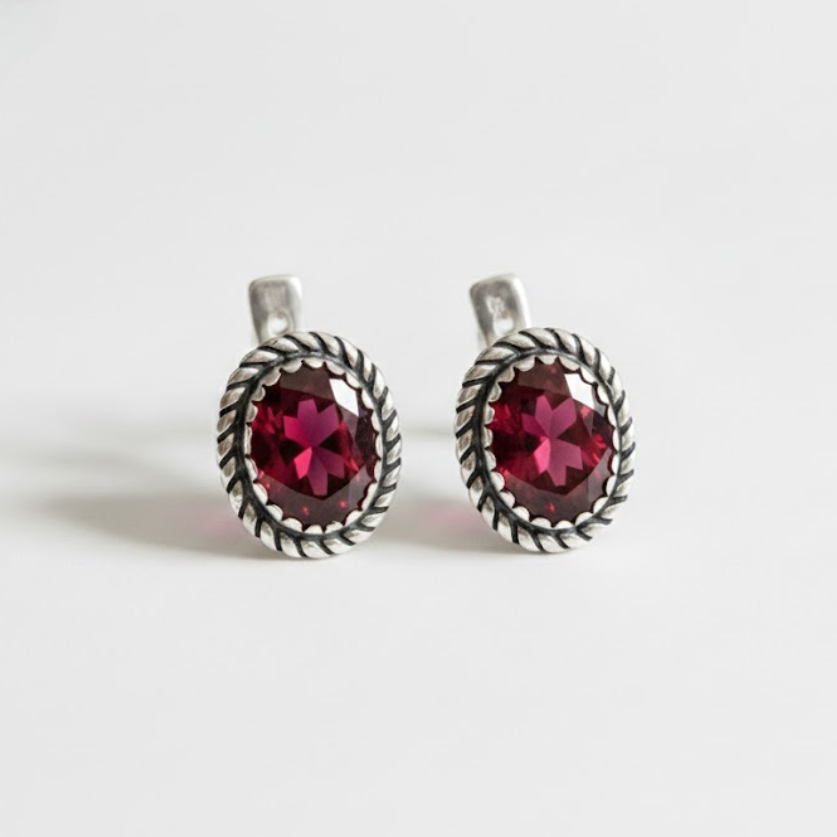Created Ruby Earrings made in 925 Sterling Silver with Oval Created Red Ruby in Solitaire setting, July Birthstone gift idea, symbolizes nobility, purity, and passion, ideal for everyday wear and perfect for birthday gifting and special occasions.
