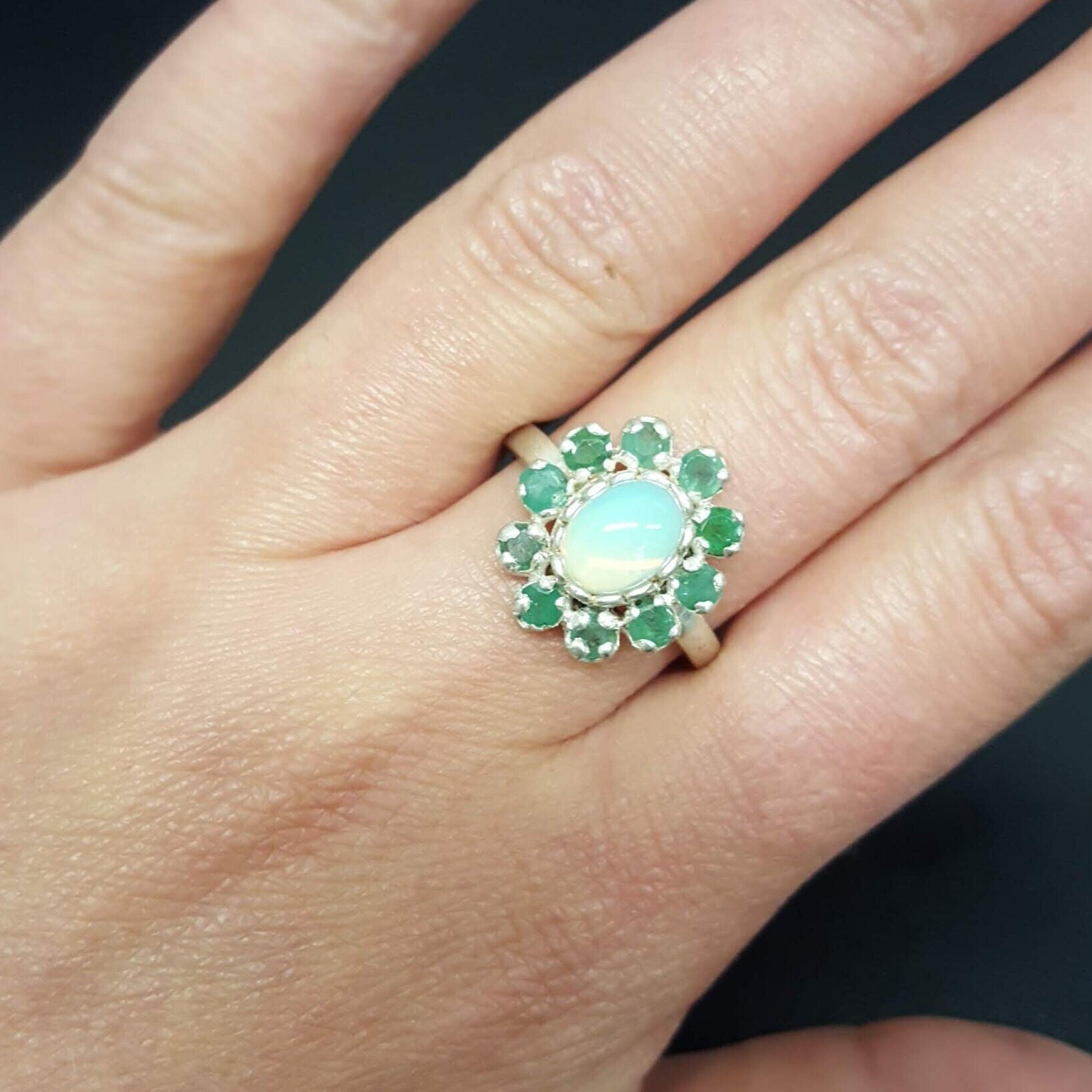Elegant 925 Sterling Silver ring featuring a vibrant green emerald, perfect for May birthdays and special occasions.