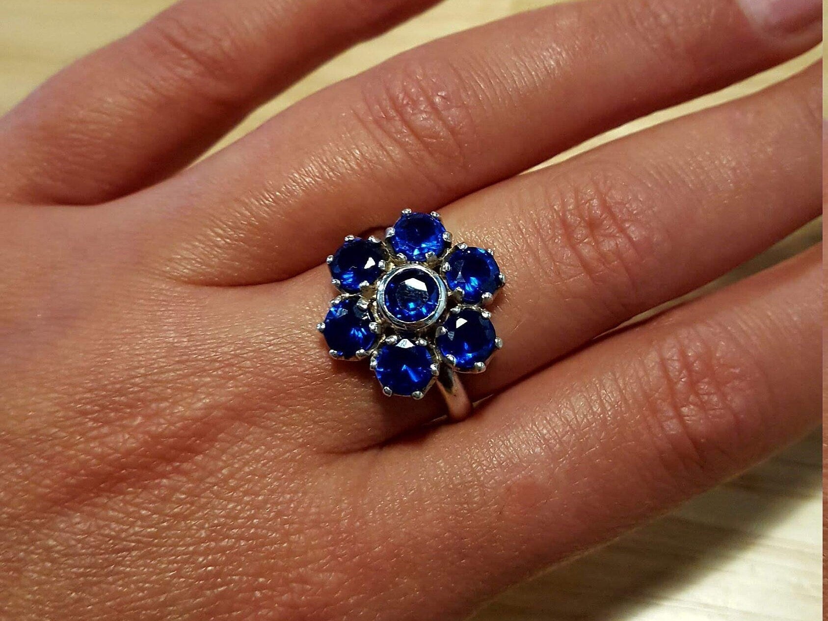 Cluster setting created sapphire ring in 925 Sterling Silver, September birthstone symbolizing faithfulness and sincerity.