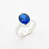 Created Sapphire Ring made in 925 Sterling Silver with Oval Created Blue Sapphire in Bezel setting, September Birthstone gift idea, symbolizes sincerity, truth, and faithfulness, ideal for everyday wear and perfect for birthday gifting and special occasions.